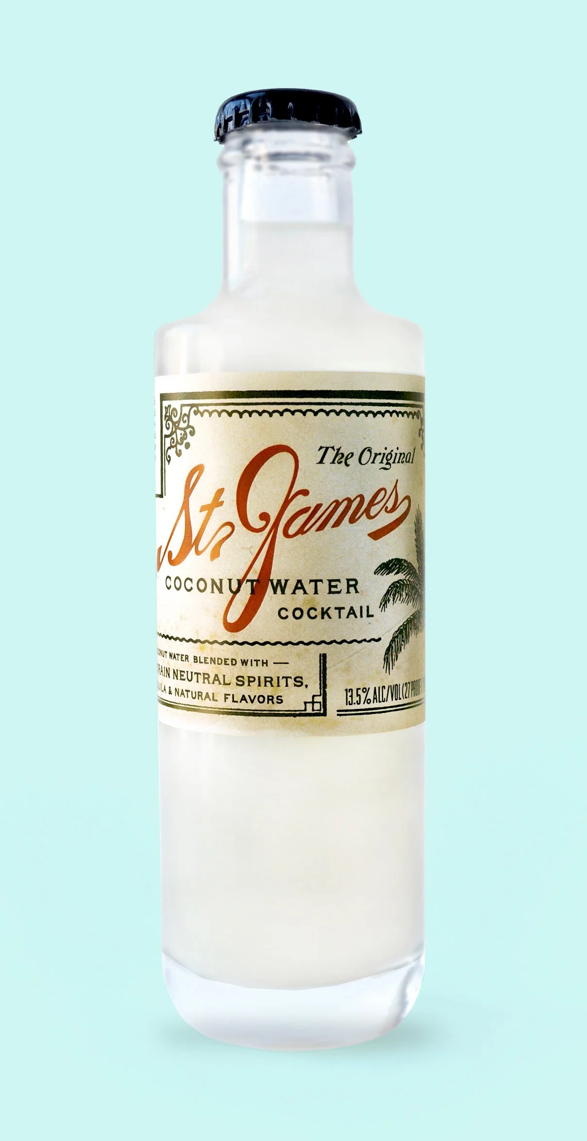 A glass bottle of St. James coconut water cocktail with a black cap, label showing coconut palm illustration, and info about alcohol content, against a light blue background.