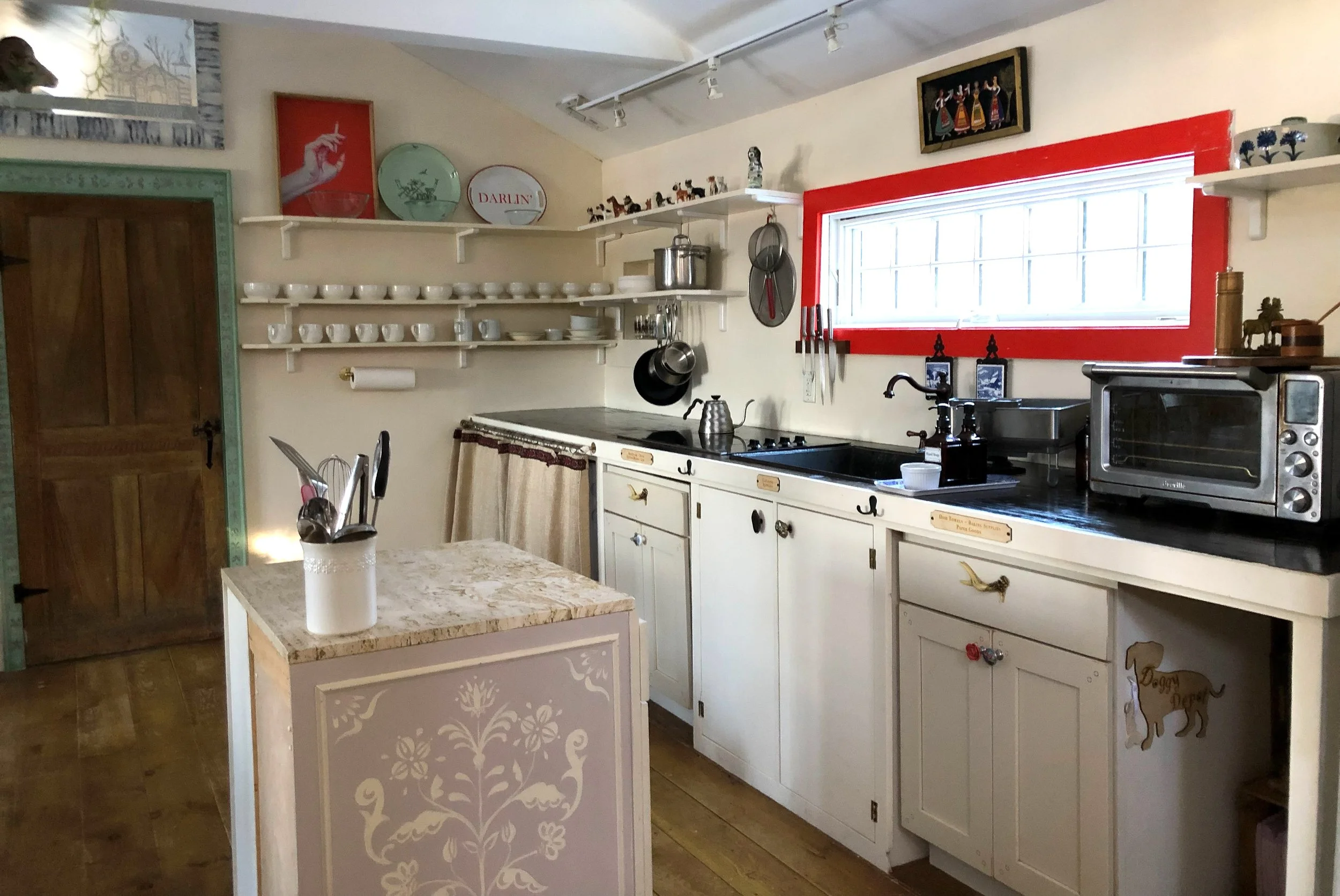 Our gallery kitchen has a four-burner induction range and an apartment-sized convection oven.