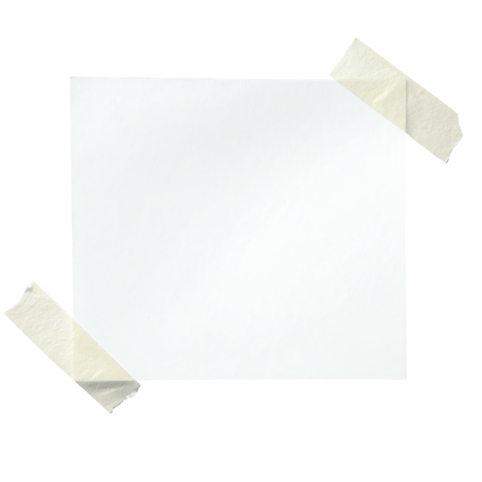 Blank white sheet of paper taped to a surface with two pieces of masking tape, one on the top right corner and one on the bottom left corner.