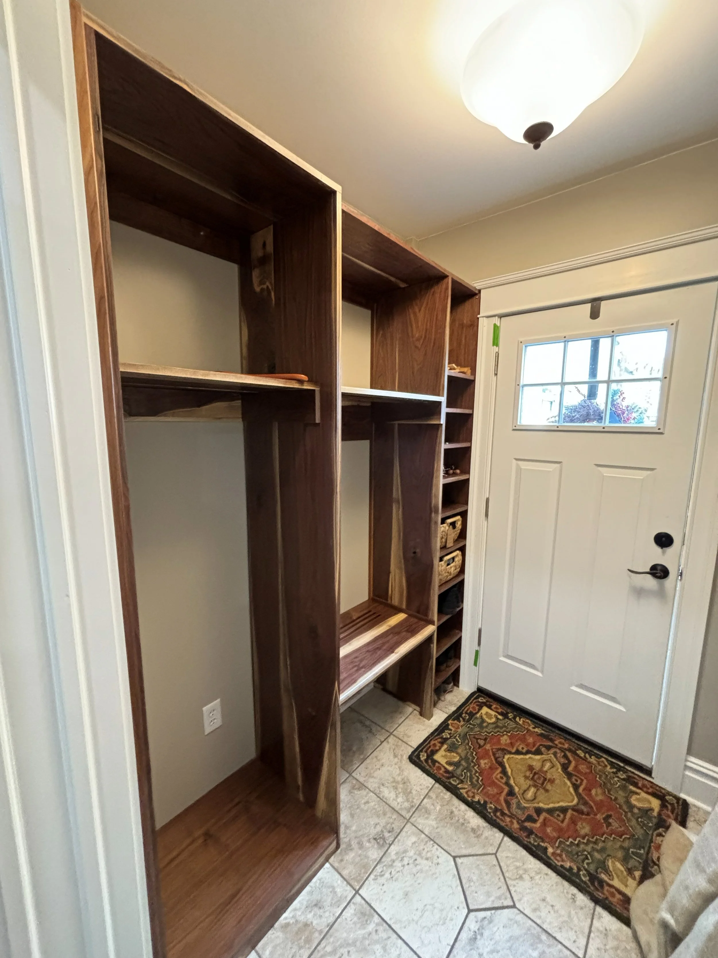 R.E. Arnold's Custom Construction. Walnut wooden custom built-in unit.