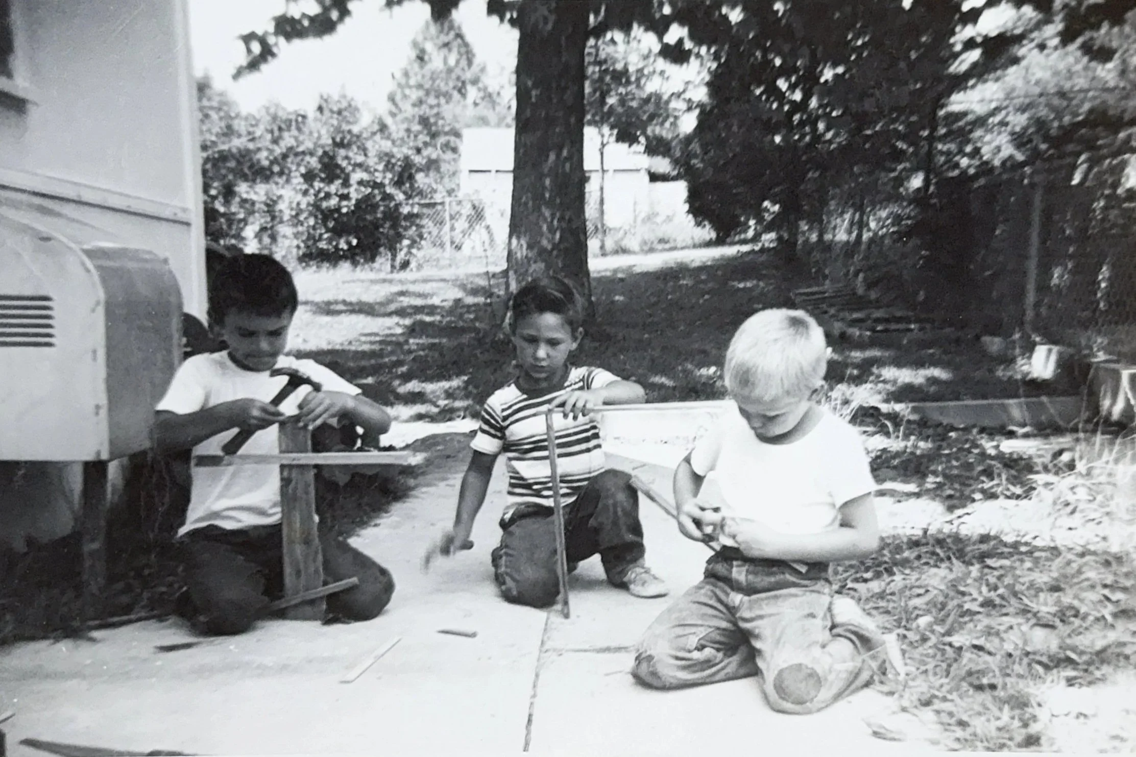 R.E. Arnold's Custom Construction — young Bob building with wood as a child, early start in the trades
