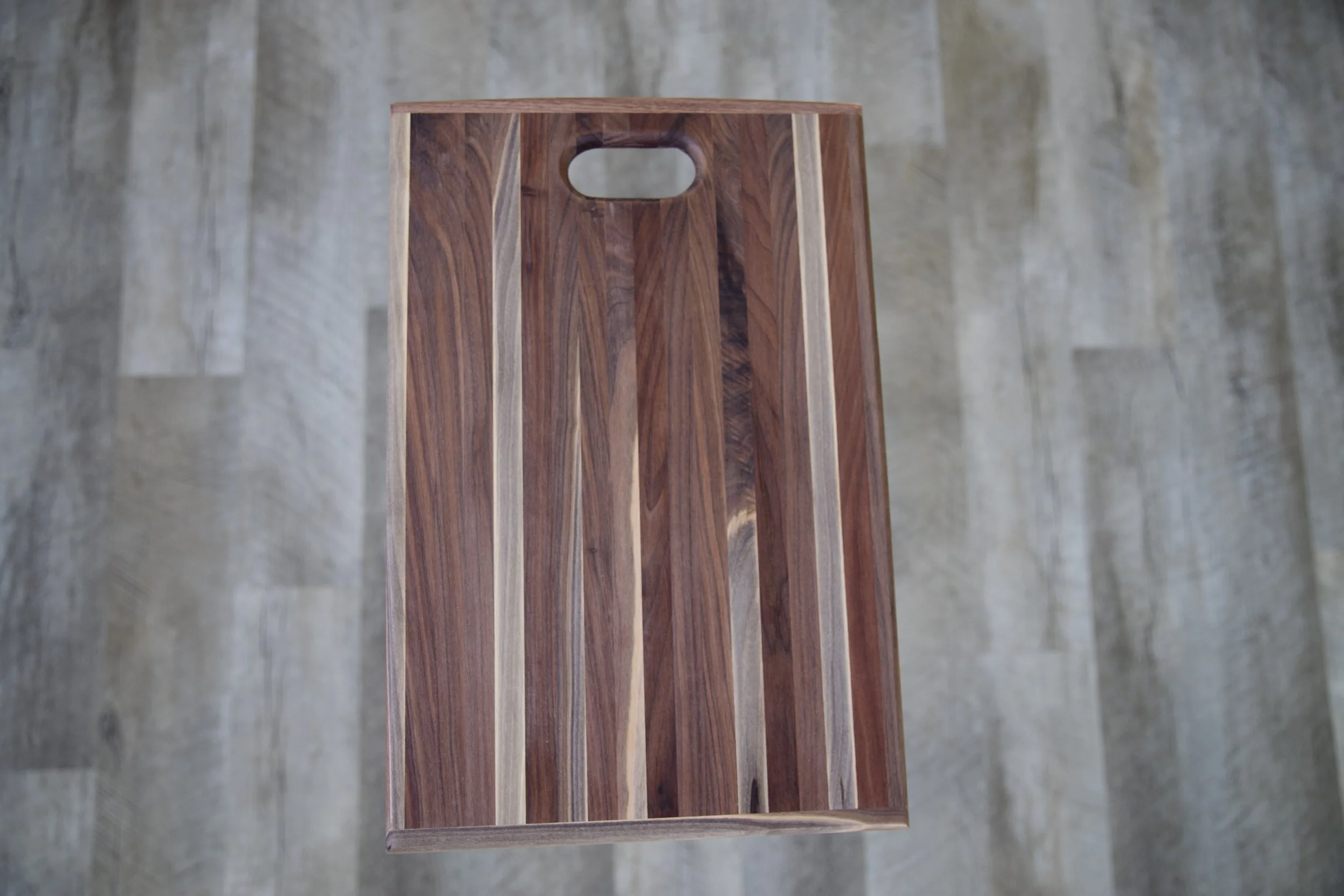 R.E. Arnold's handmade walnut cutting board with handle cutout in Gettysburg PA