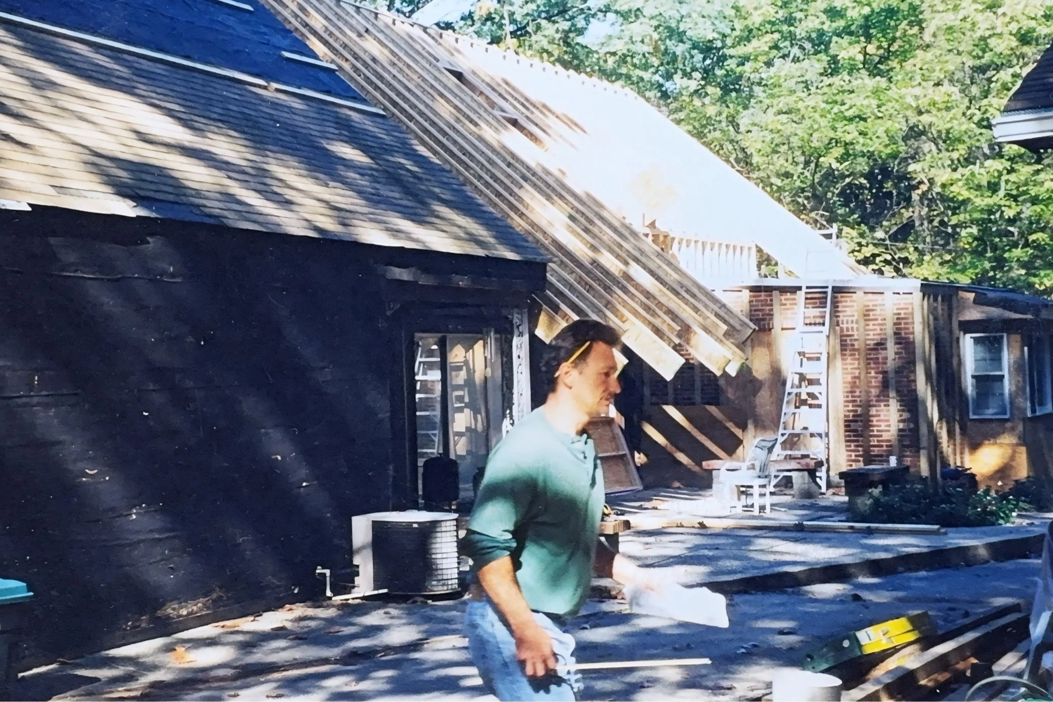 R.E. Arnold's Custom Construction — Bob working a roofing job site in his early construction career