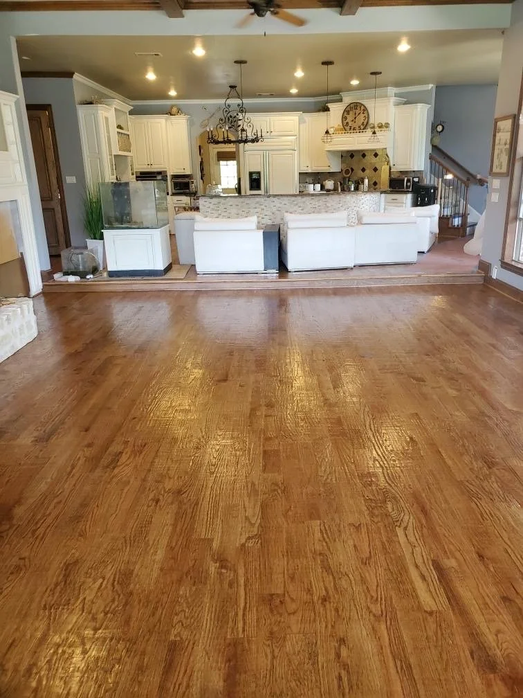 4" White Oak Hardwood Installation – Allen, TX. Solid white oak flooring installed, sanded, hand-scraped, and finished to create a warm, timeless foundation for this open living space.