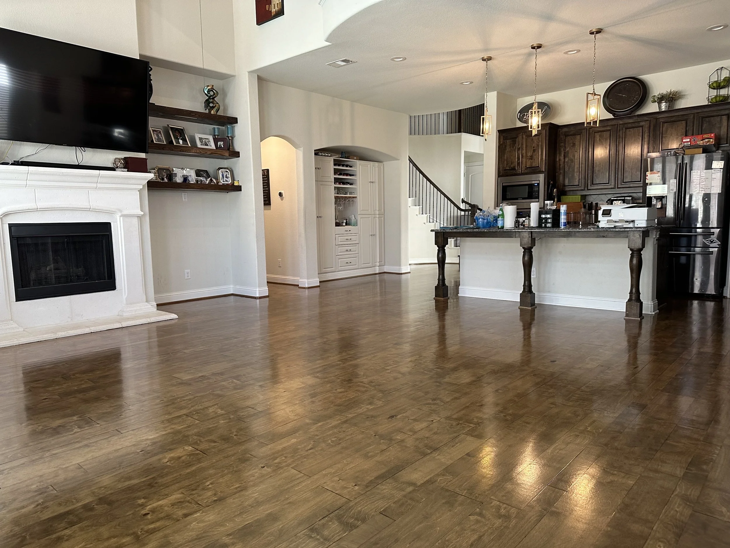 Engineered Hardwood Floor Refinish – Little Elm, TX. Existing engineered hardwood floors professionally refinished to restore warmth and enhance the open living area.