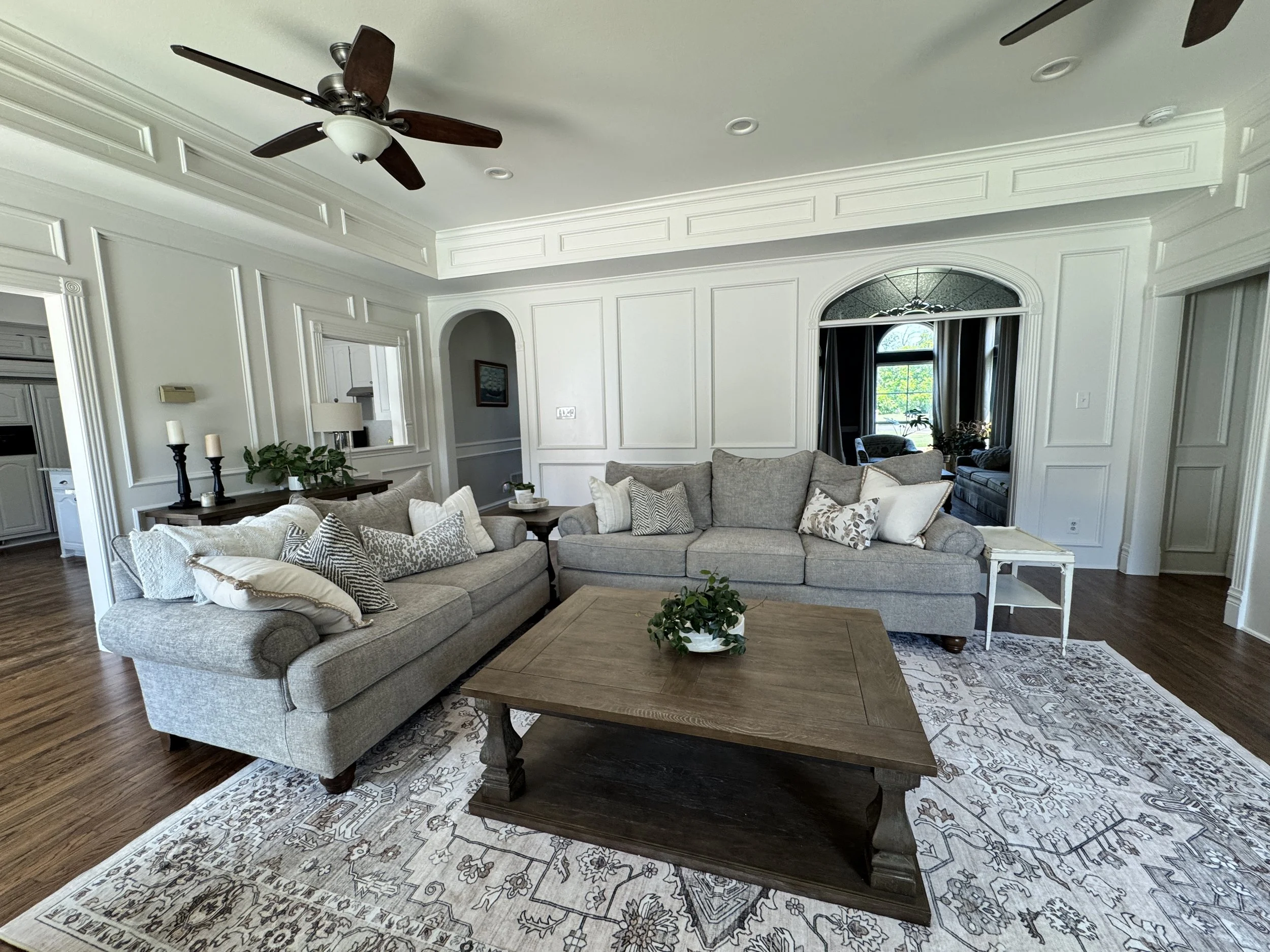 Freestanding Tub & Floor-Mount Faucet Bathroom Design – McKinney, TX. Modern bathroom featuring a standalone soaking tub with a floor-mounted faucet, complemented by light porcelain tile flooring and classic subway tile accents.