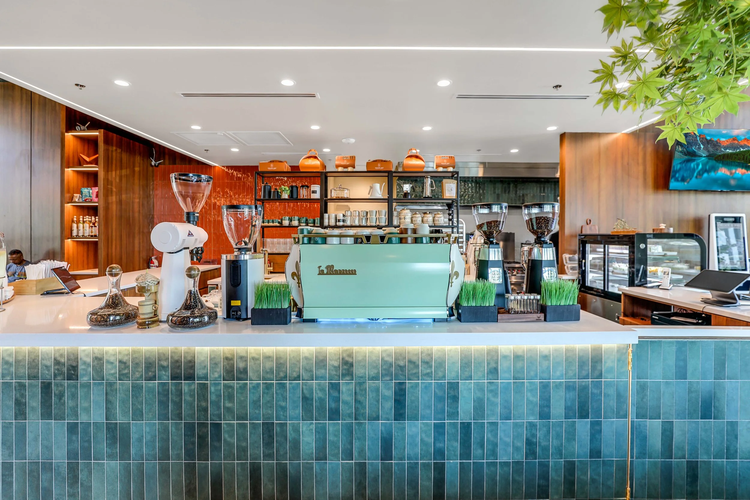 Coffee Bar Counter Tile – Escape 360 Café, McKinney, TX. Rich teal tiles add color and texture while providing a durable surface for this modern specialty coffee bar.