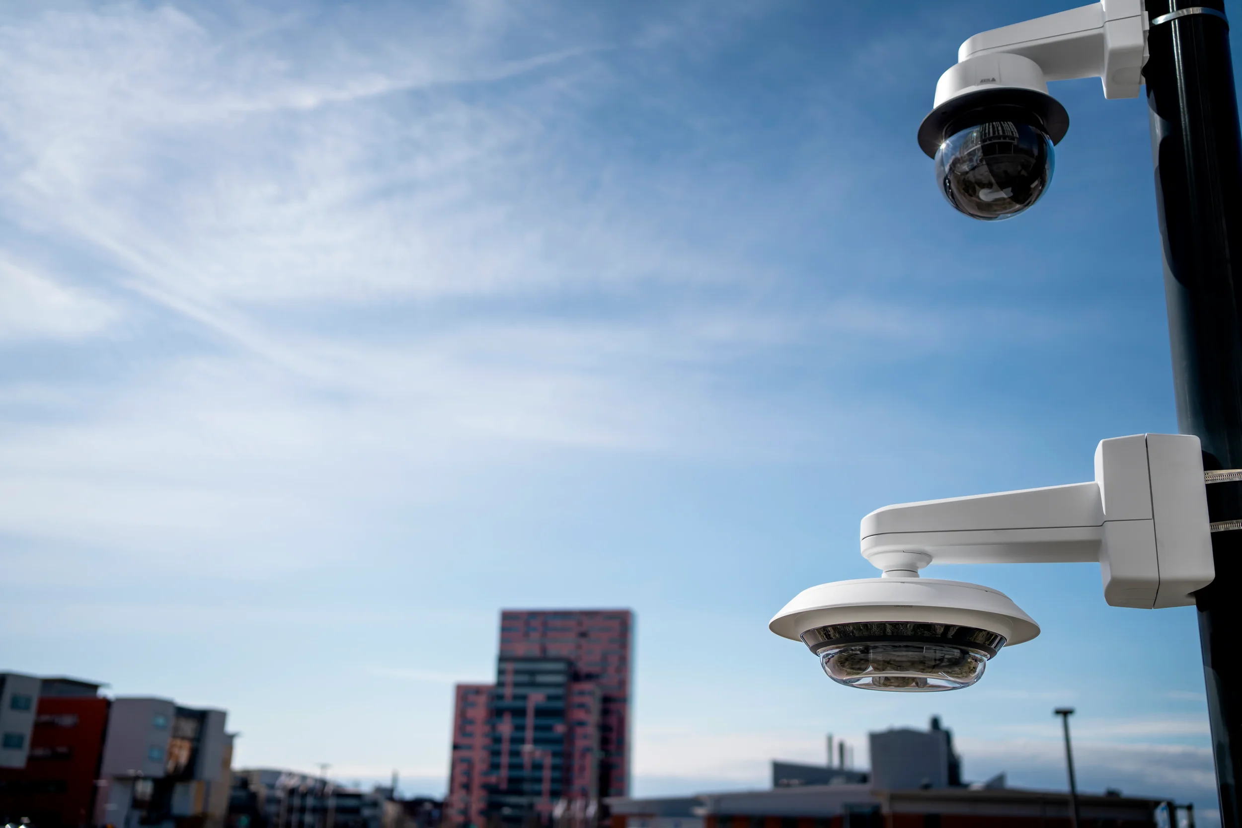 Commercial surveillance cameras mounted on building exterior for perimeter security and monitoring