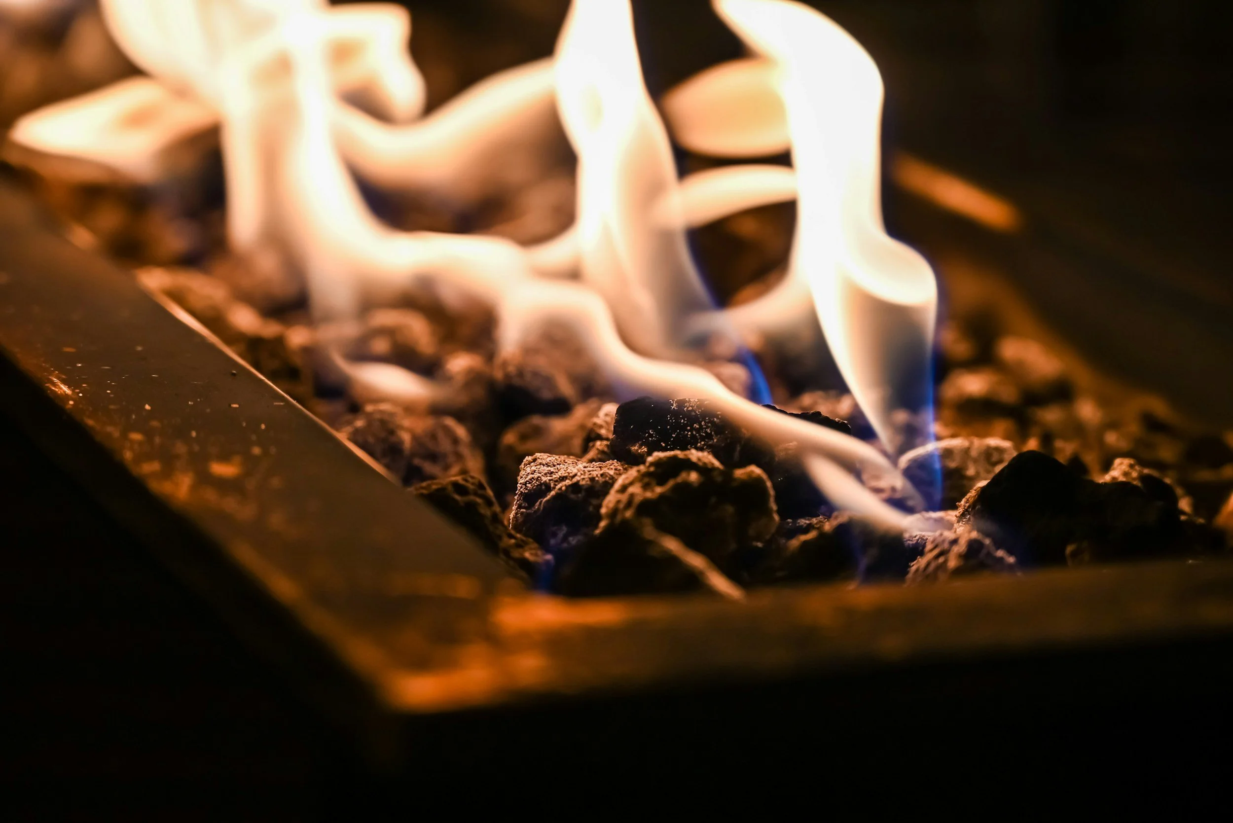 Close-up flames burning in a gas fireplace burner