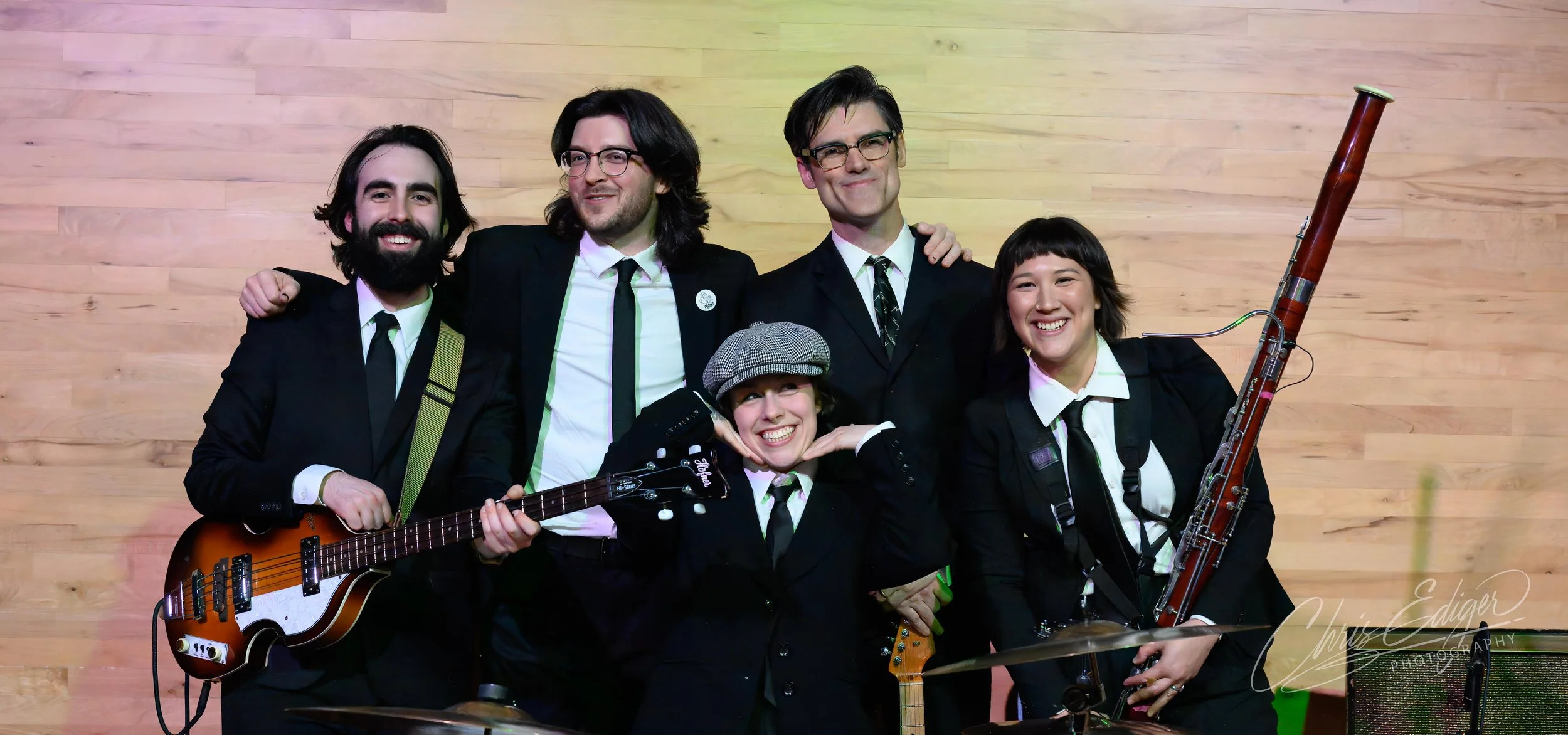 The Oh Boys and The Swallowtails pose for a group shot at the end of their combined performance at Green Guitar.