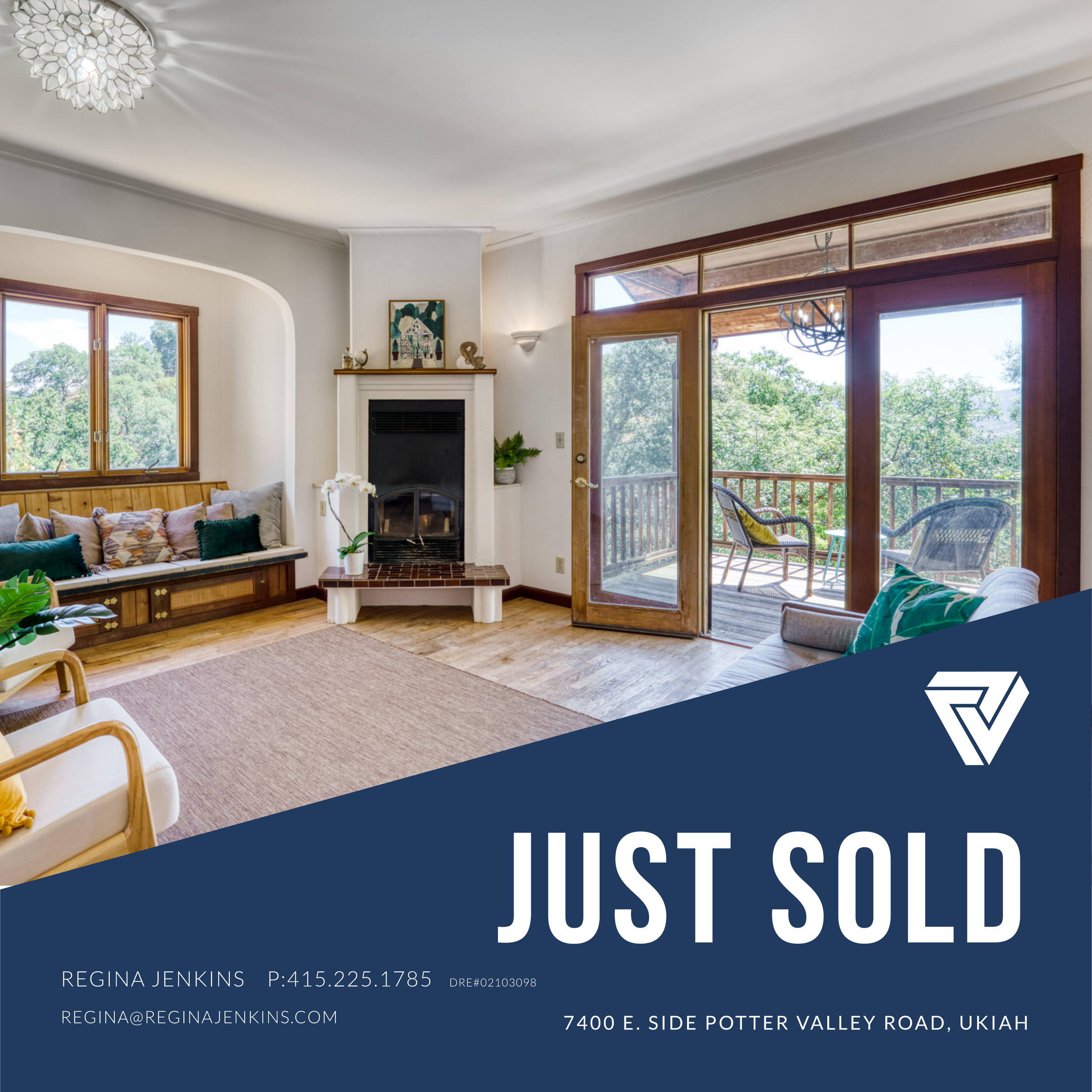 Living room with fireplace, large window, door leading to balcony with outdoor seating, and a seating area with cushions.