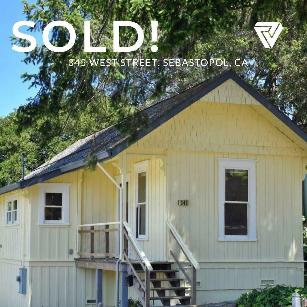 Yellow house on a hill with a staircase leading to the front door, surrounded by green trees, with a sold sign and address 345 West Street, Sebastopol, California.