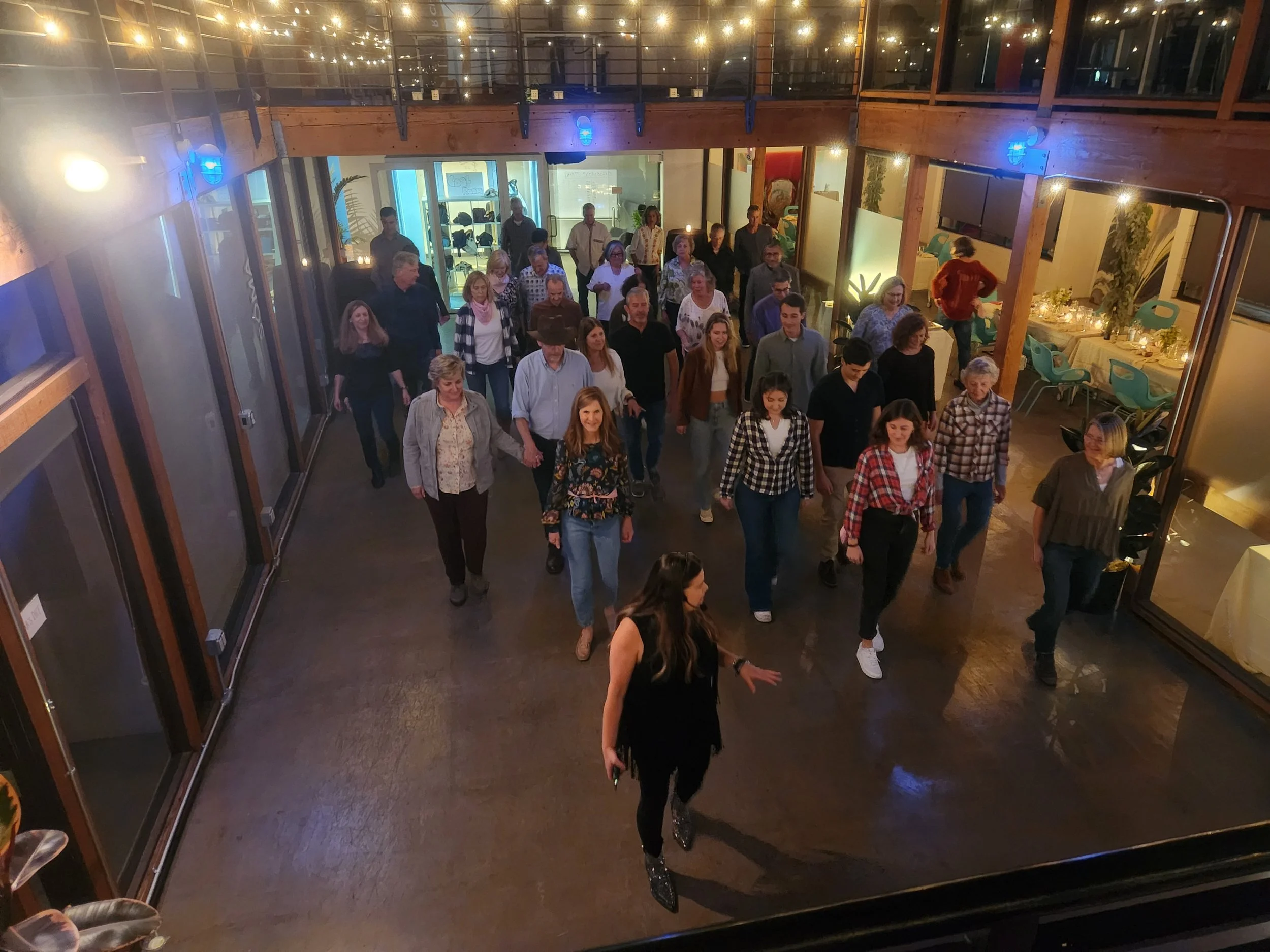 Line Dancing Lisa and DJ Shivers at a private birthday part held in an office building in San Francisco showing participants how to line dance.
