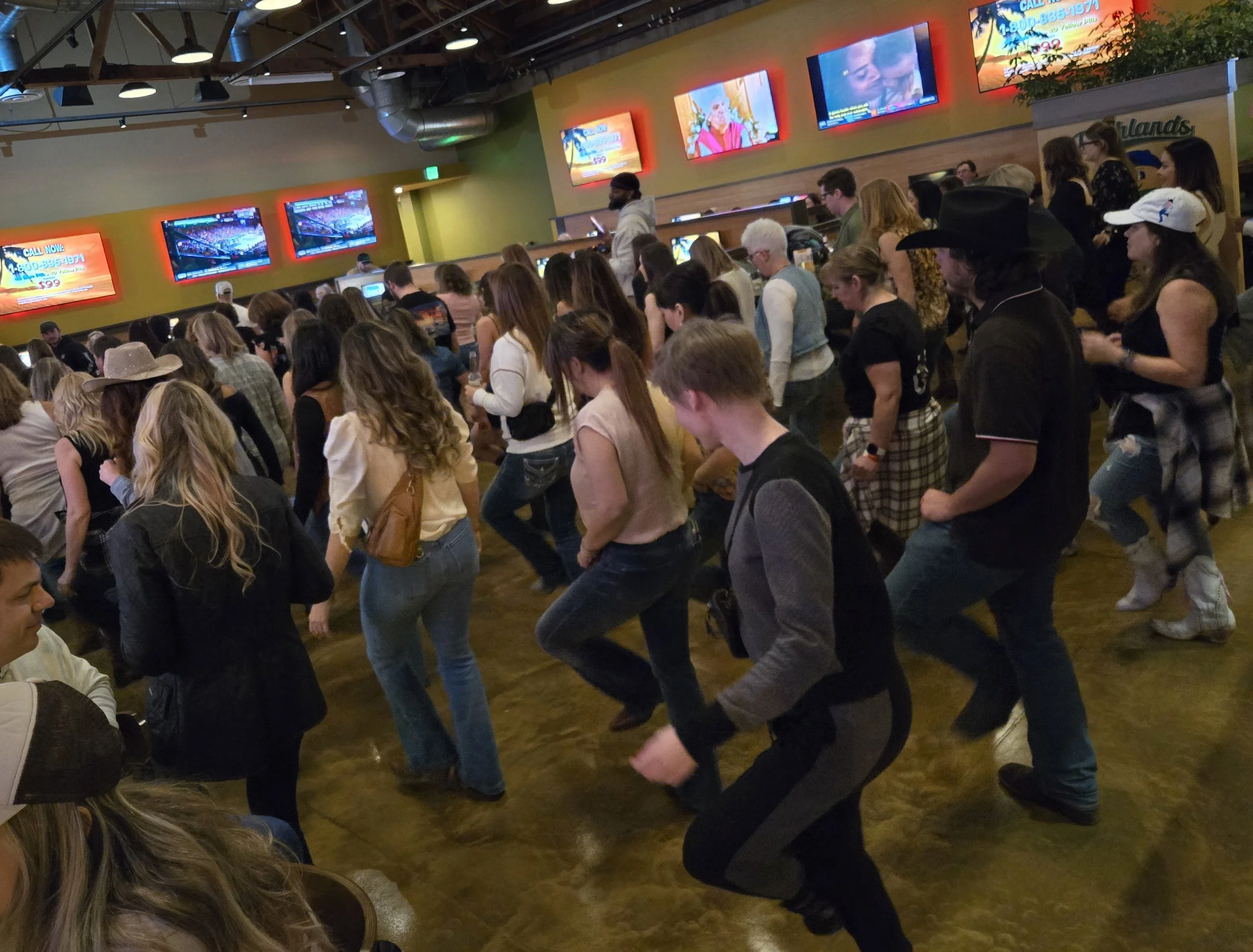 Guests dancing at DJ Shivers country night at Highlands Sports Bar and Grill in San Carlos with line dancing and high-energy crowd engagement.