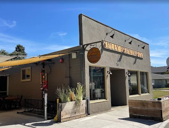 Exterior of a building labeled 'Kelly Brewing Co.' where DJ Shivers and Line Dancing Lisa will have a line dancing event outside.