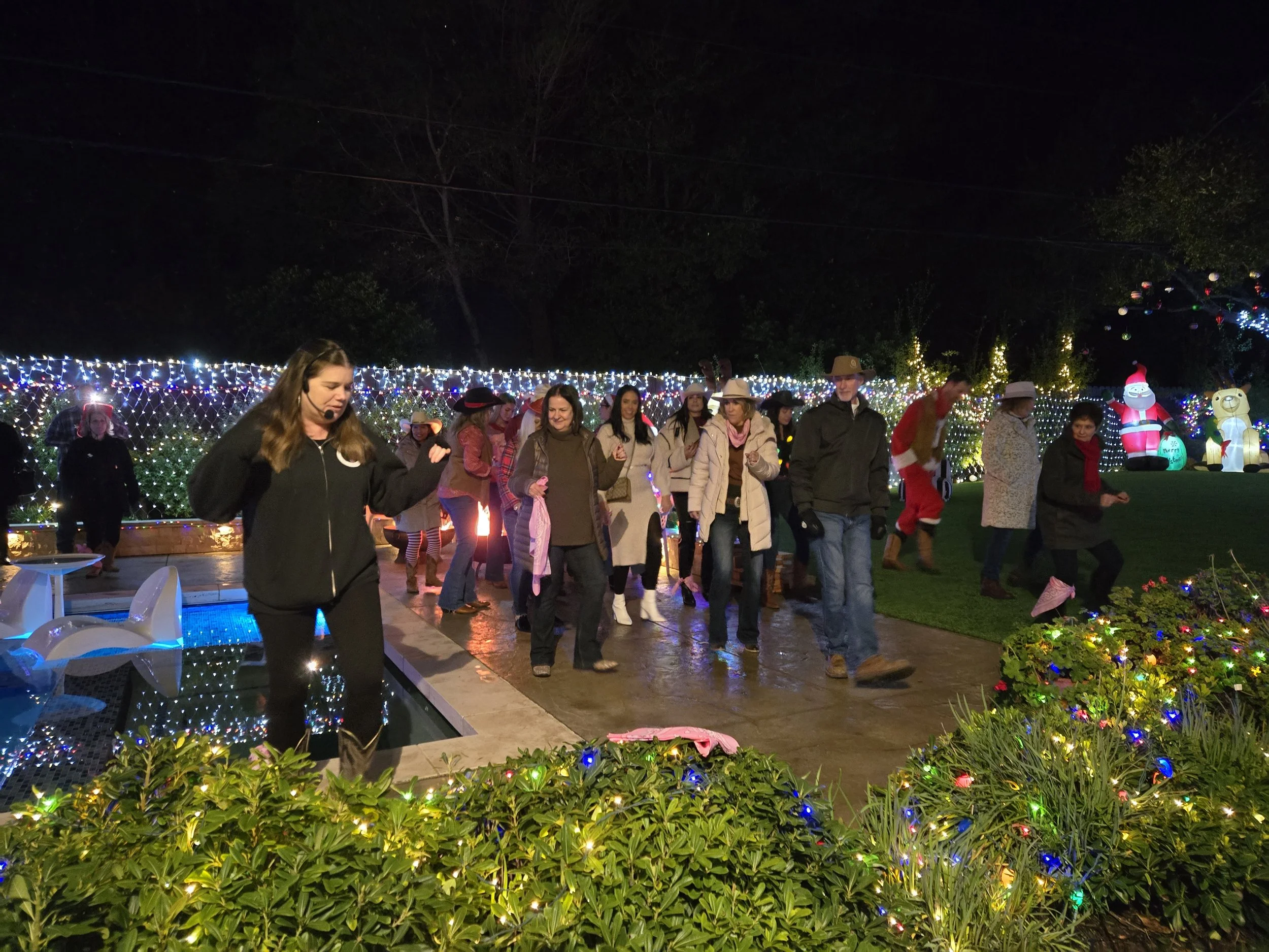 Outdoor neighborhood holiday country line dancing event with DJ Shivers in the Bay Area featuring festive lights, music, and group dancing. Private event in Hillsborough.