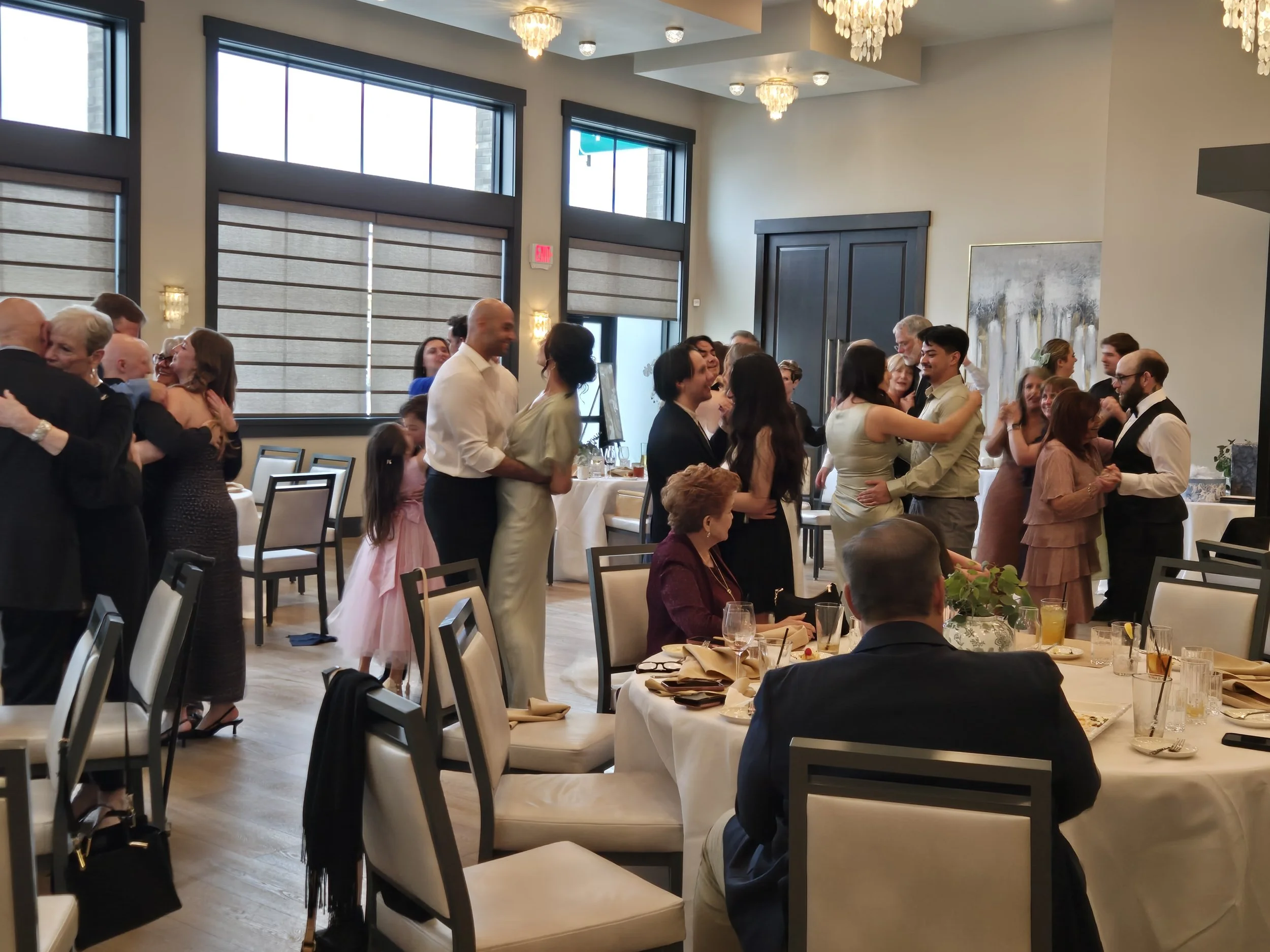 Group of people dancing at a wedding that utilized DJ Shivers as their wedding DJ