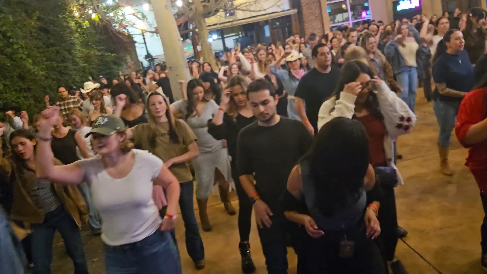 Crowd line dancing at DJ Shivers weekly country night at Old Wagon Saloon in San Jose featuring beginner-friendly lessons and a packed dance floor.