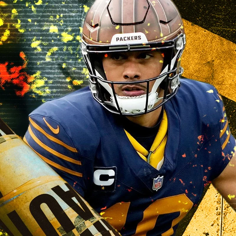 Close-up of a football player in a dark blue jersey with yellow accents, wearing a brown helmet with a faceguard, and a captain's patch on the chest. The background is partially obscured with yellow and black paint splatters.