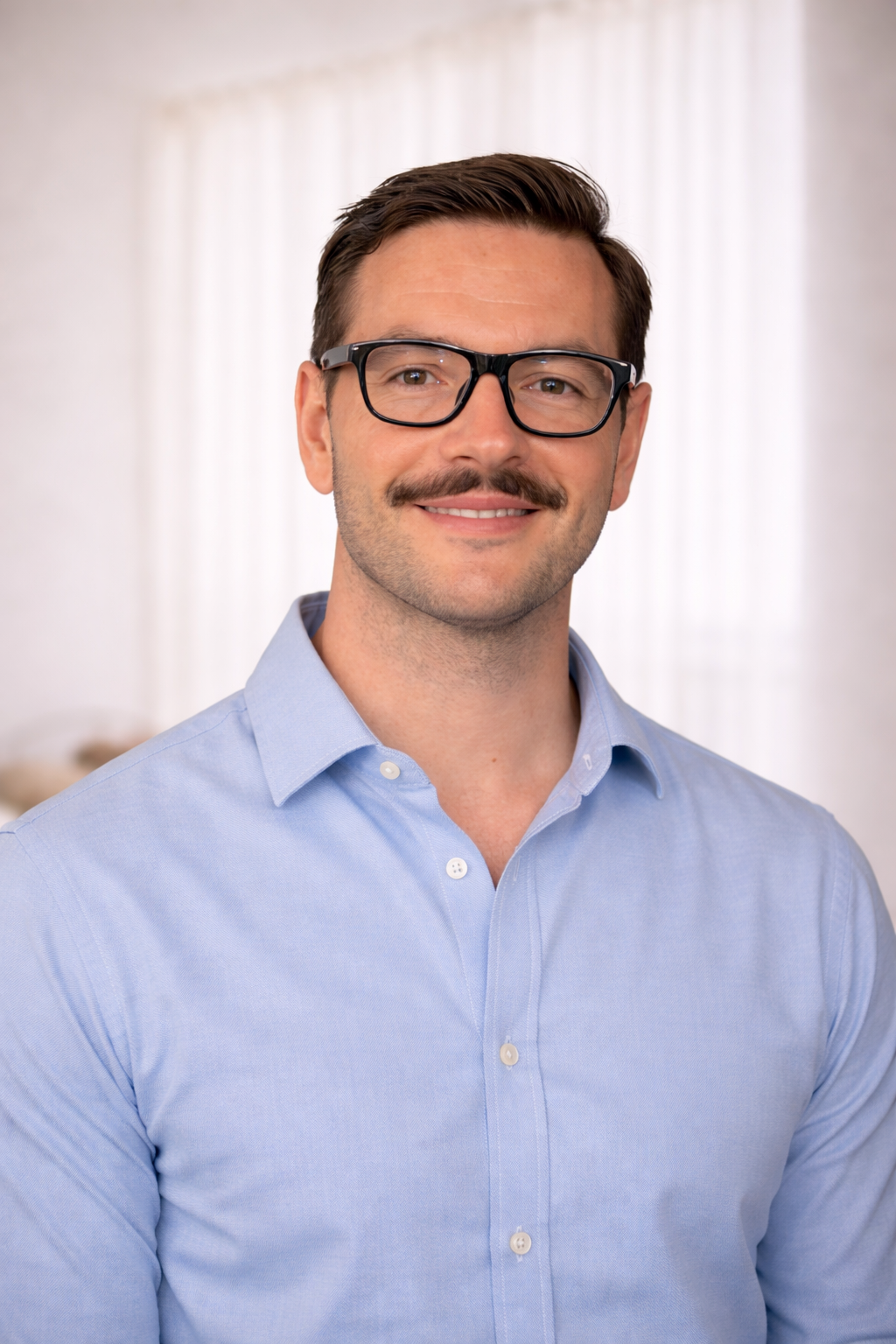 Bradley Benson counsellor seated in therapy room, West End Brisbane