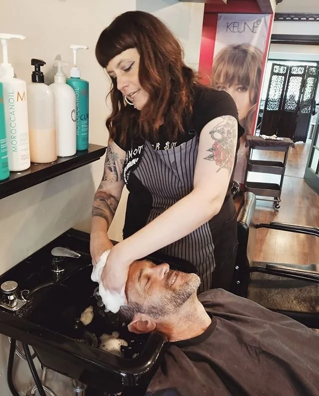 Owner Amy giving a fantastic shampoo scalp massage to a client