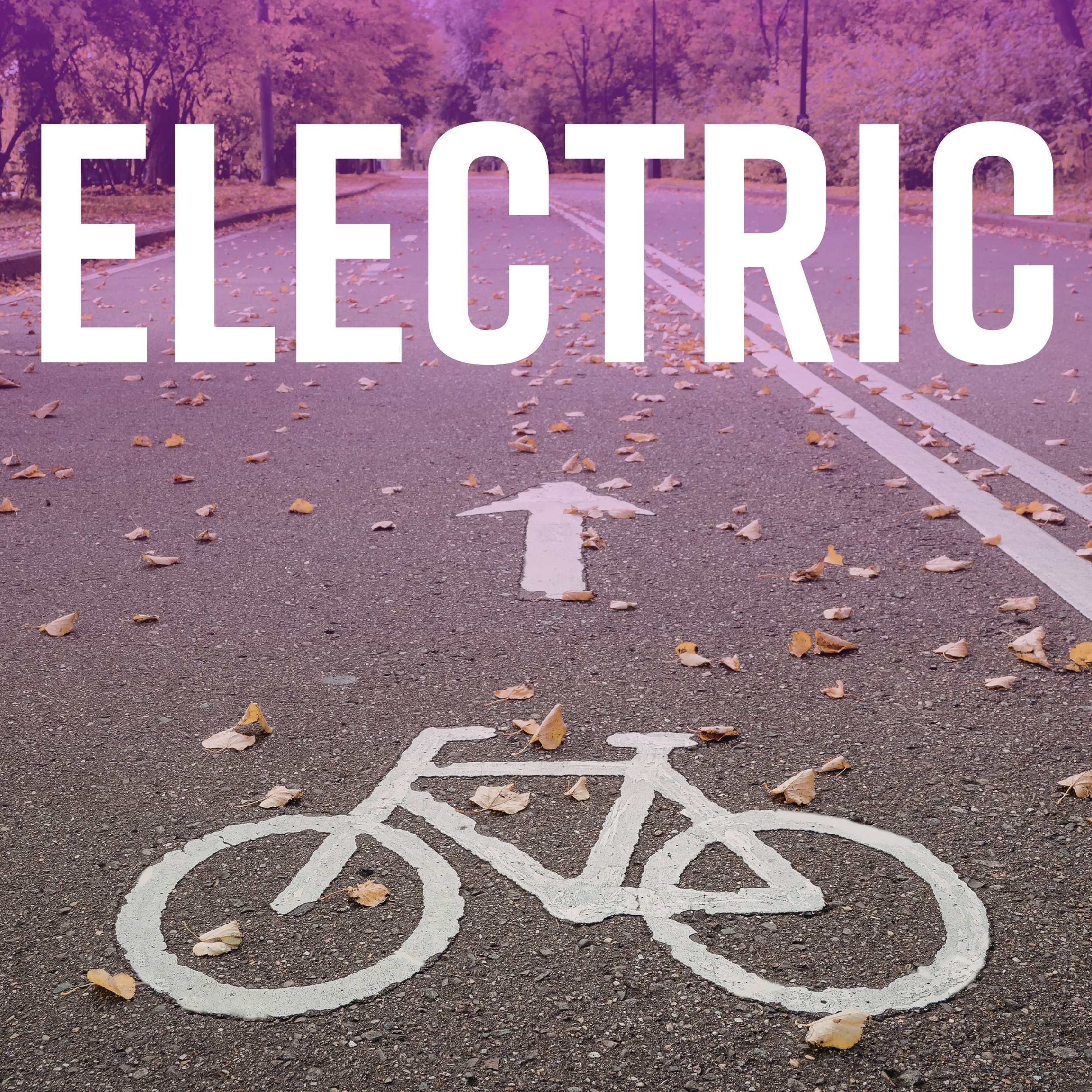 A road with white lines and fallen leaves, with trees in the background and the words 'ELECTRIC' in large white letters over the image.