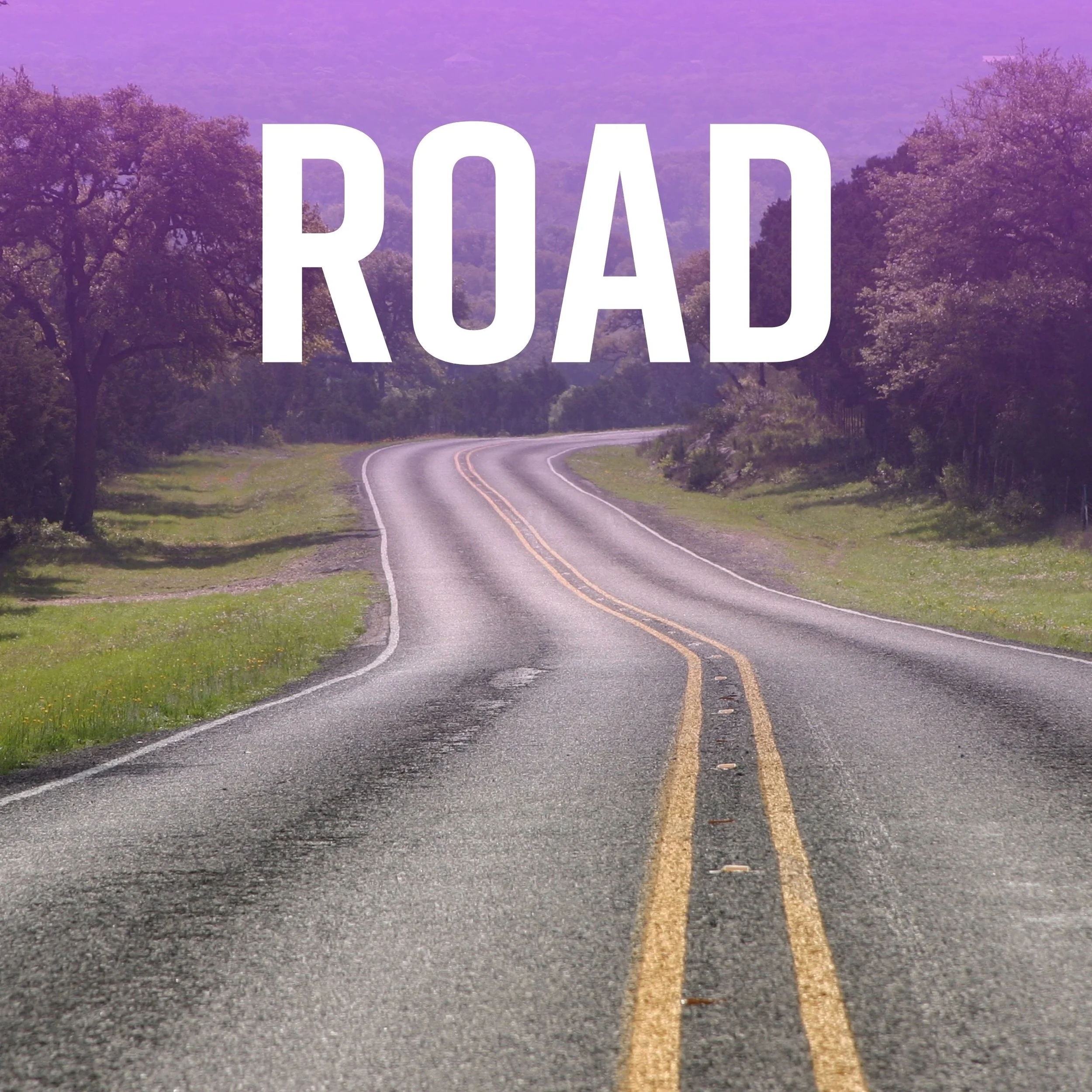 A winding two-lane road with yellow dividing lines, surrounded by grass and trees, leading into a purple mountain landscape background, with the word 'ROAD' in large white letters across the image.