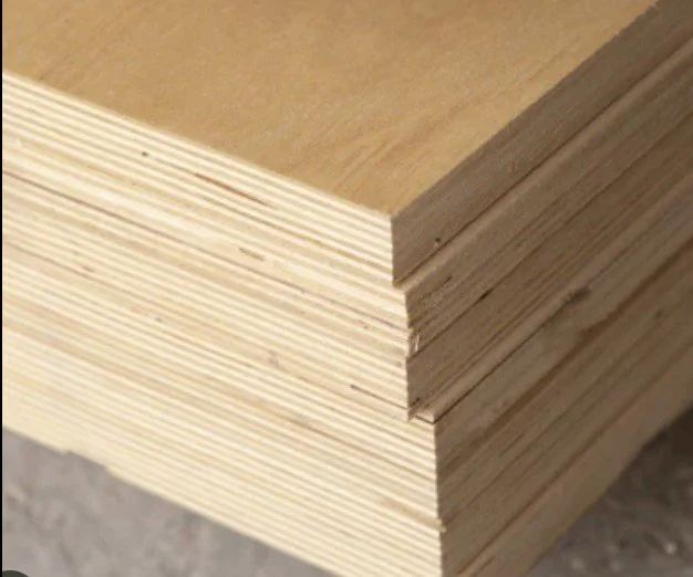 Close-up of a stack of plywood sheets with visible layers.