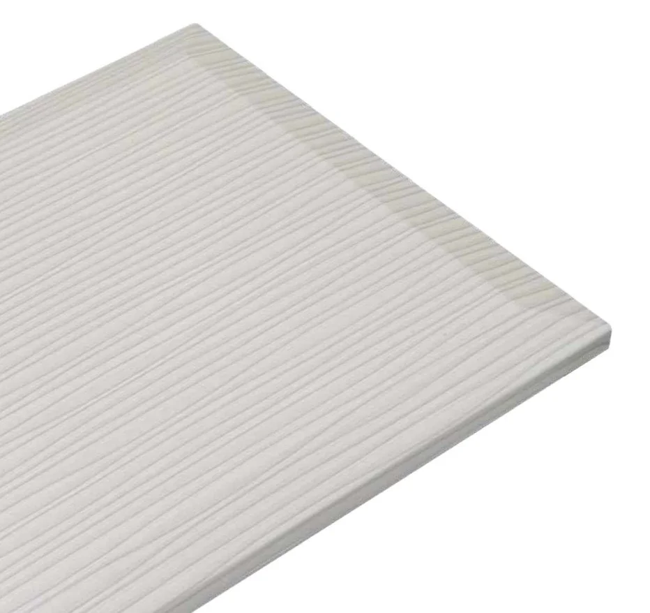 Close-up of a stack of white, textured foam or cardboard panels with horizontal ridges.