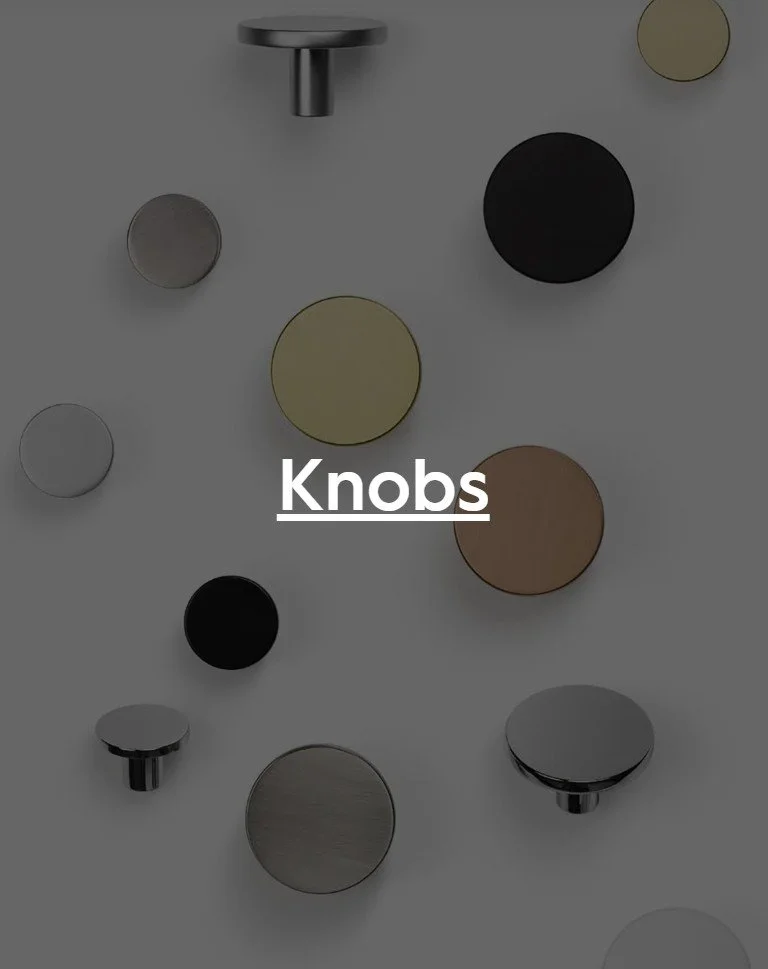 Various decorative cabinet knobs and pulls in different shapes, sizes, and finishes, arranged on a white background.