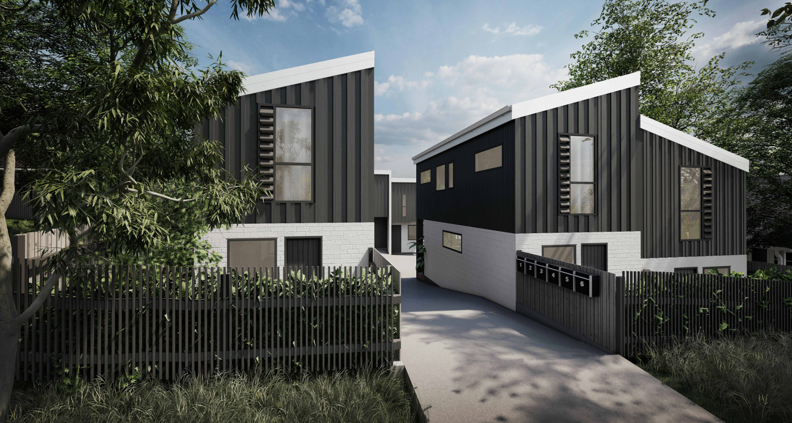 Torbay project: multi-level townhouses on a sloping section with dark vertical cladding.