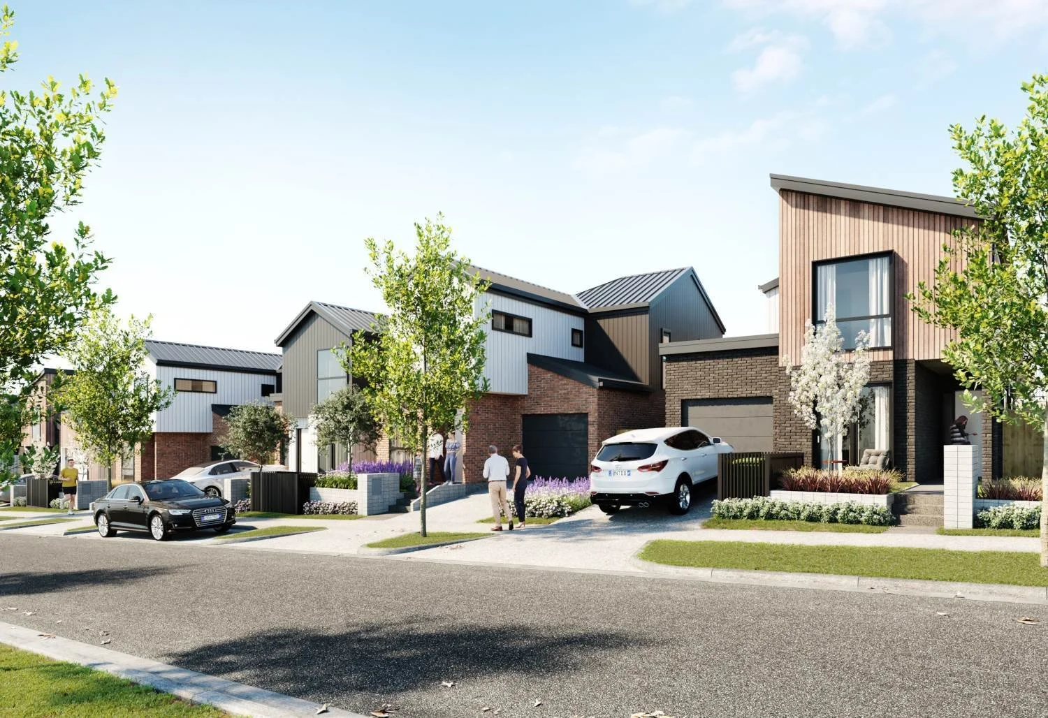 Architectural render of a modern new-build residential street featuring contemporary homes with mixed brick, timber, and white panel cladding. The landscaped neighborhood design showcases diverse rooflines, paved driveways, and integrated parking.