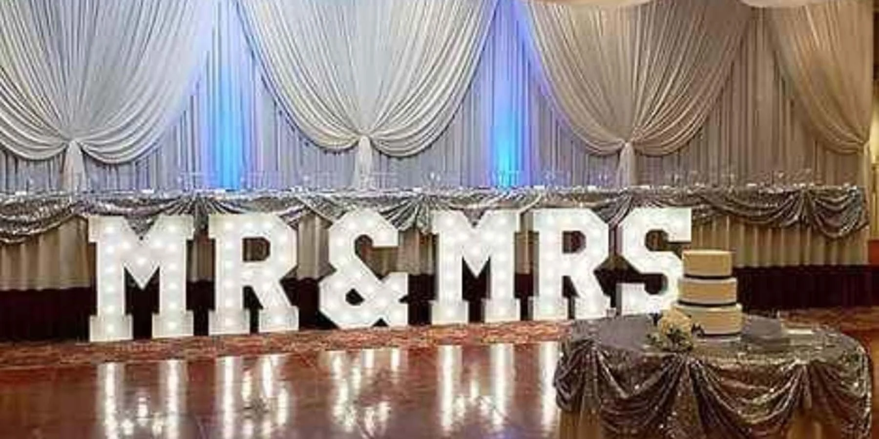 Wedding reception held inside marquee tent with elegant lighting in Indianapolis