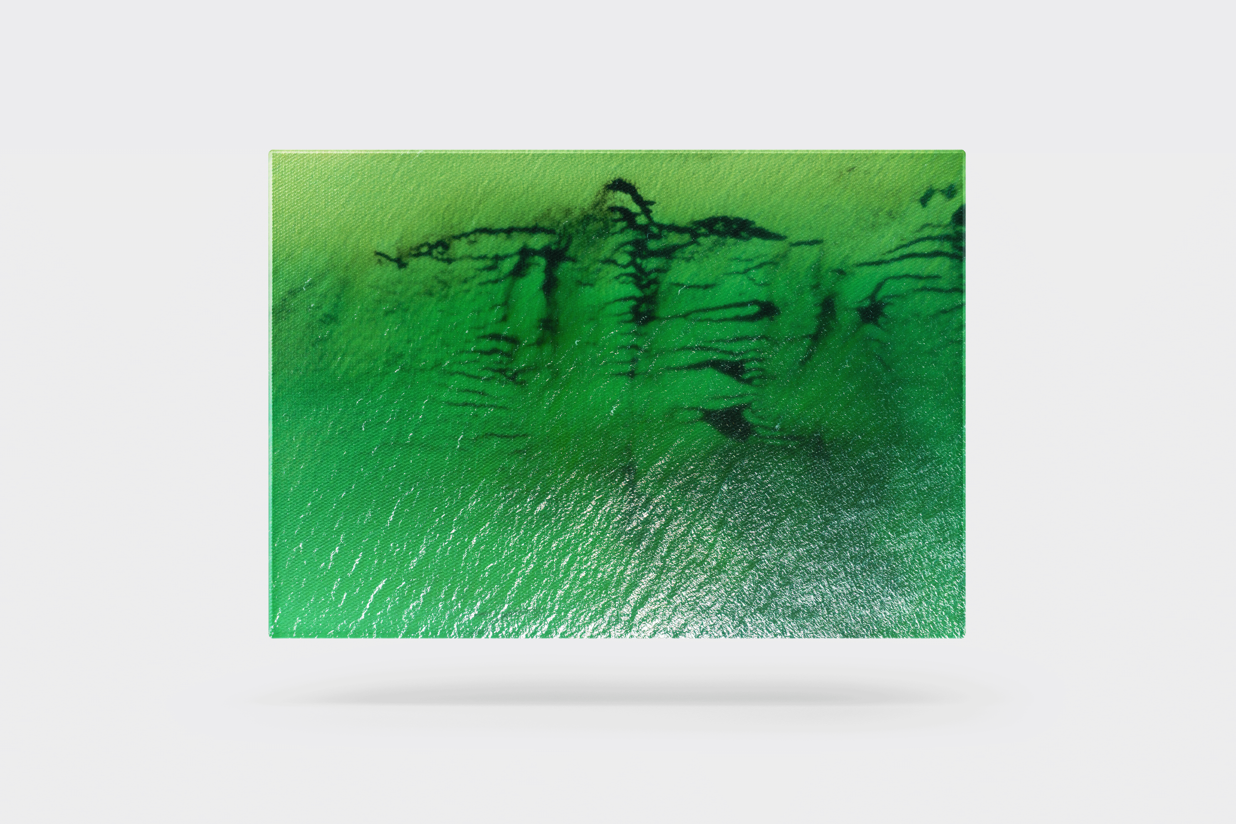 Verdigris Drift by IE Studios: A minimalist aerial photograph featuring emerald green tidal patterns and swirling water textures of the Maine coastline.