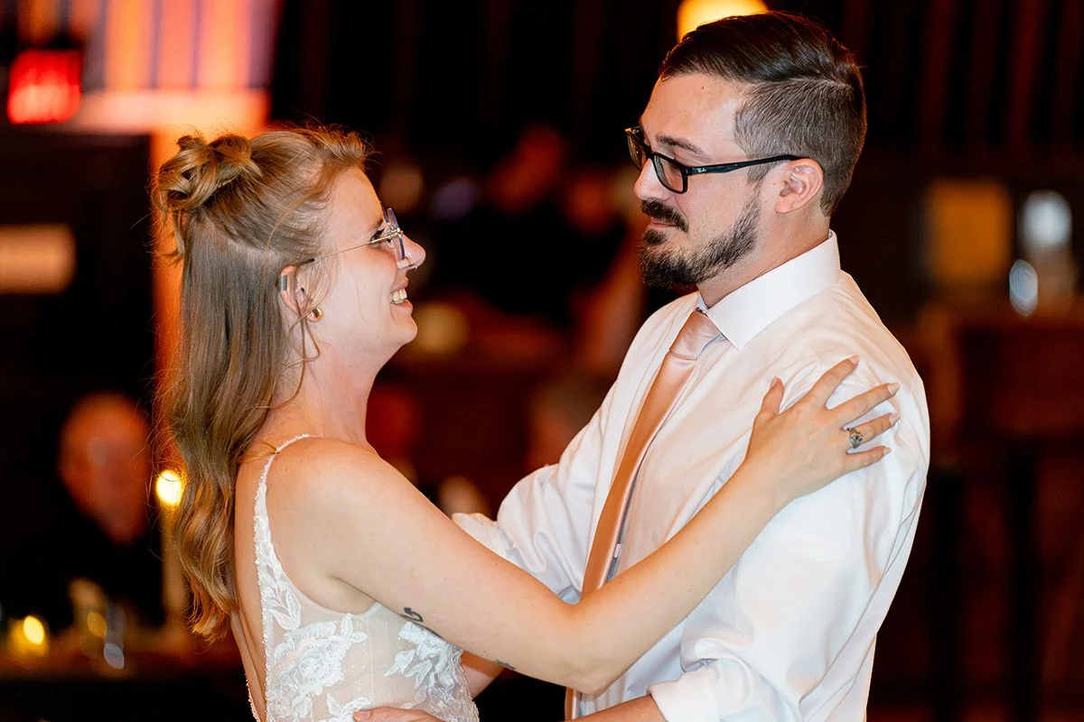 Candice smiles at Zack as they dance together at their wedding reception.