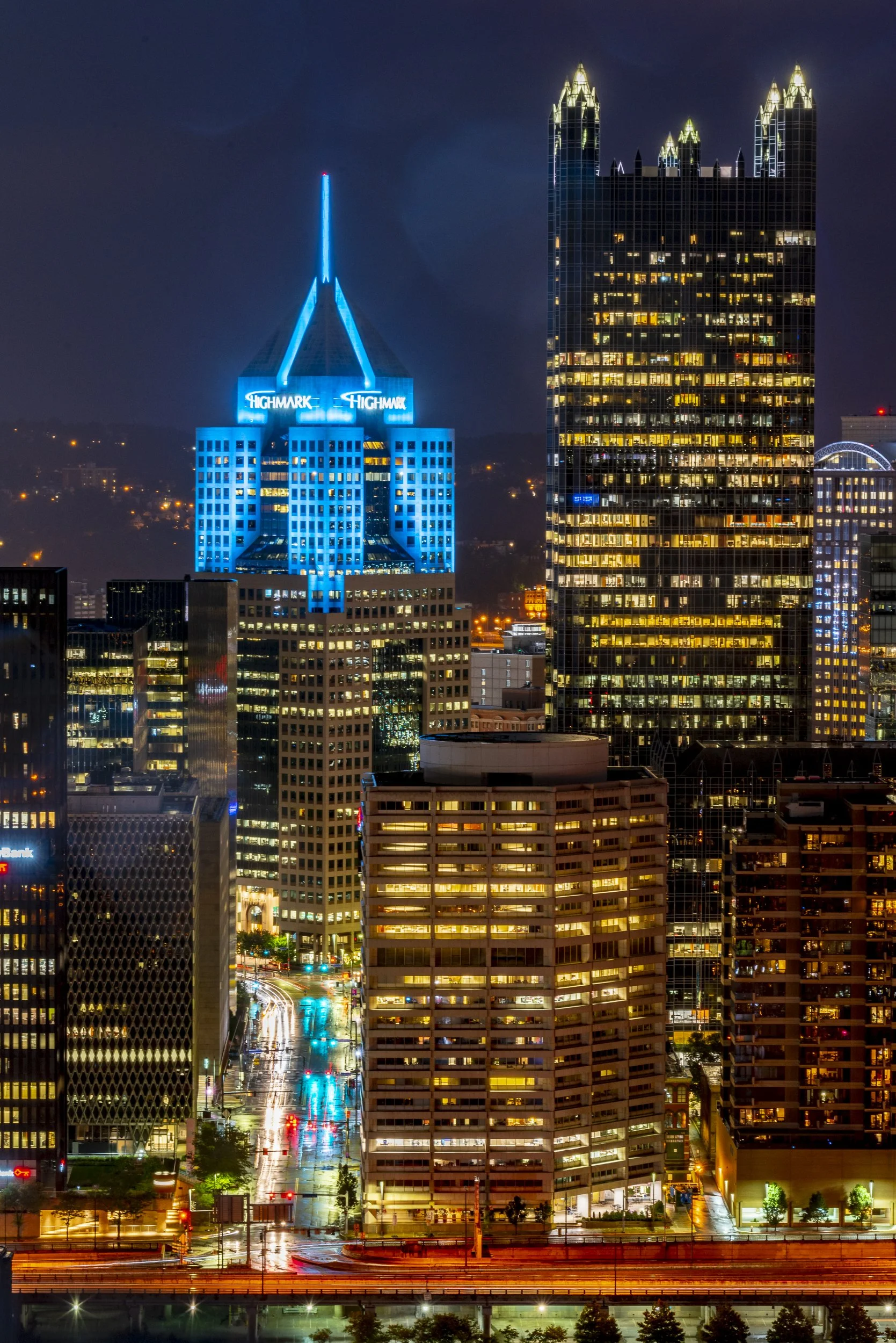 Pittsburgh's Highmark building glows blue in this nighttime skyline photo of Pittsburgh.
