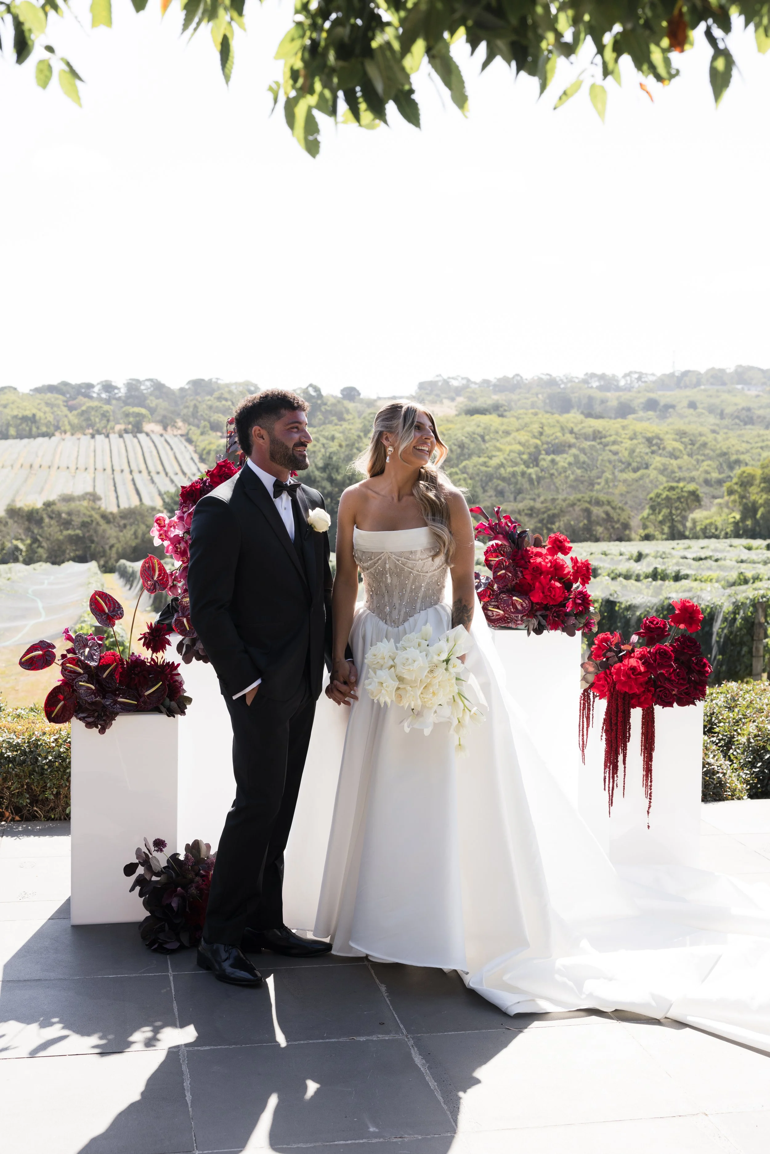 Mona Farm wedding, highland cow wedding, bride and groom kissing in a field