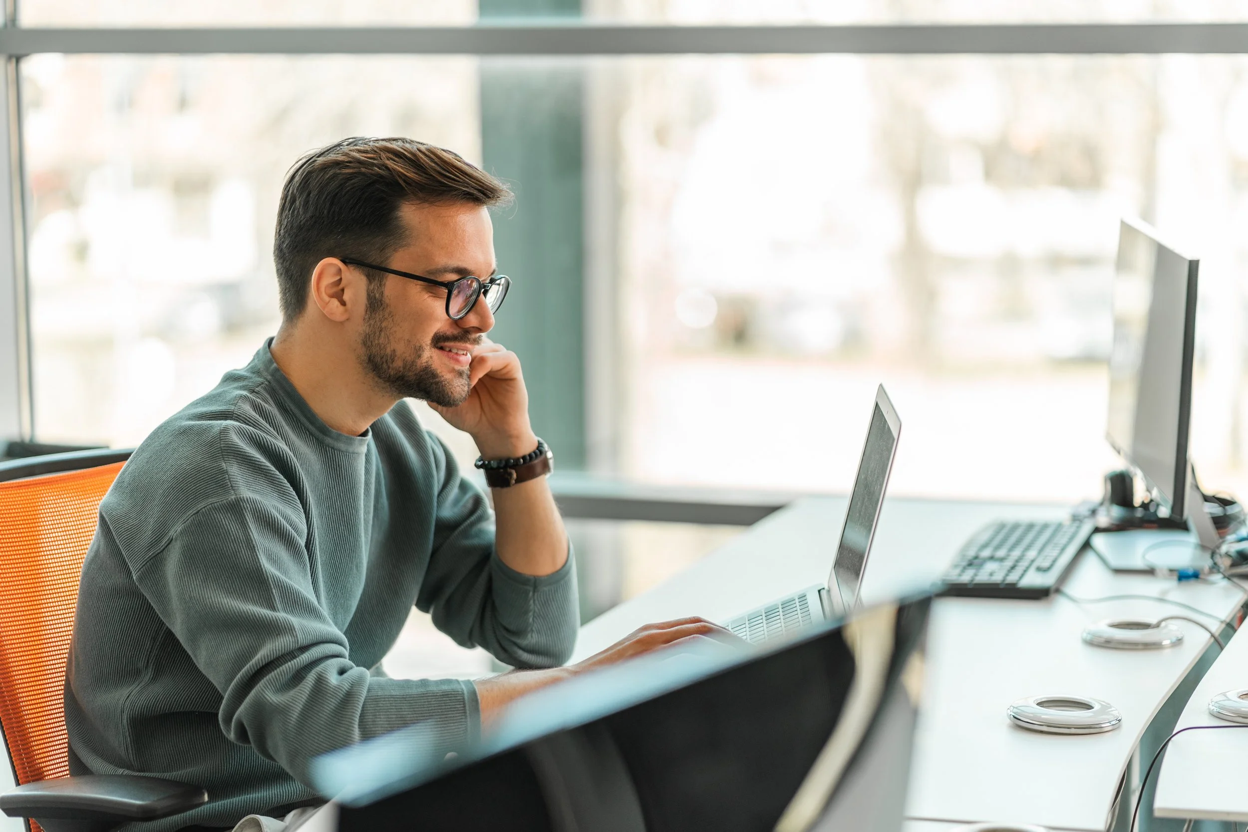 consultant sitting with laptop