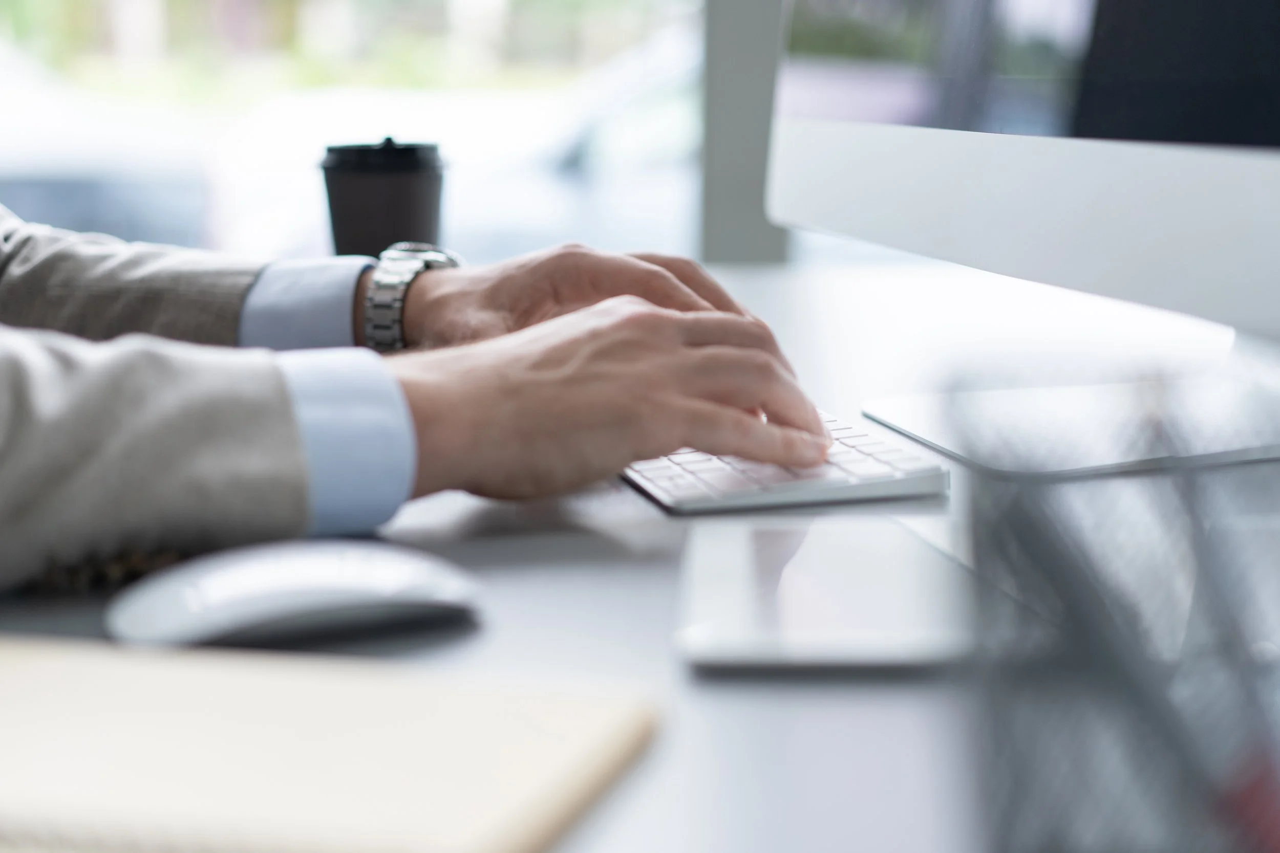 hands typing on computer