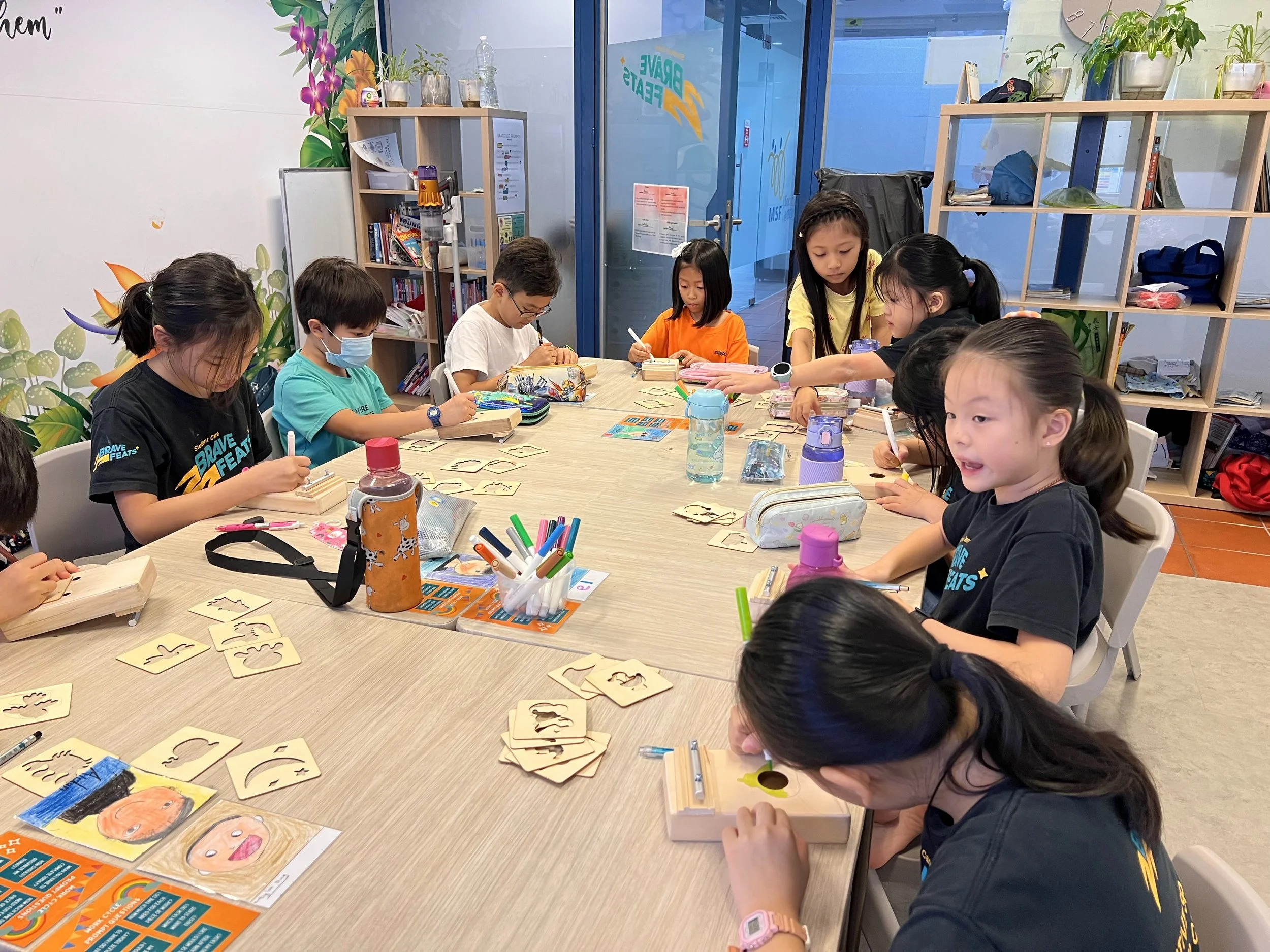 Children participating in a small-group STEM workshop with guided facilitation