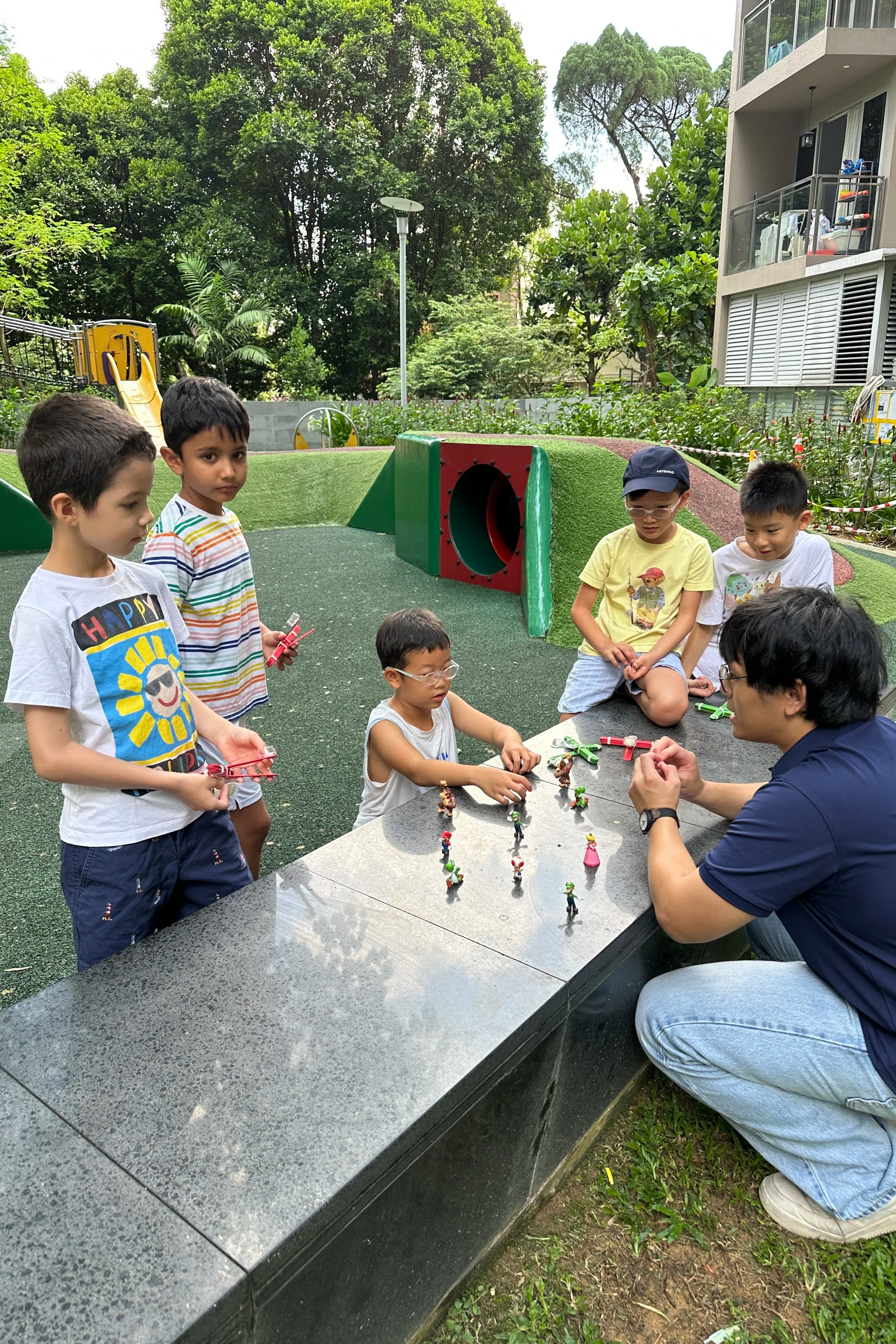 Students exploring nature and discussing ideas during an outdoor STEM learning activity