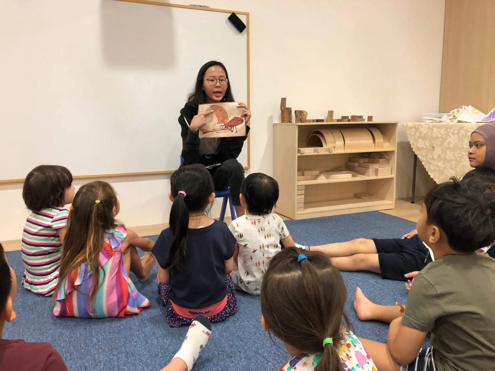 preschool children learning about leonardo da vinci stem inventions in holiday workshop