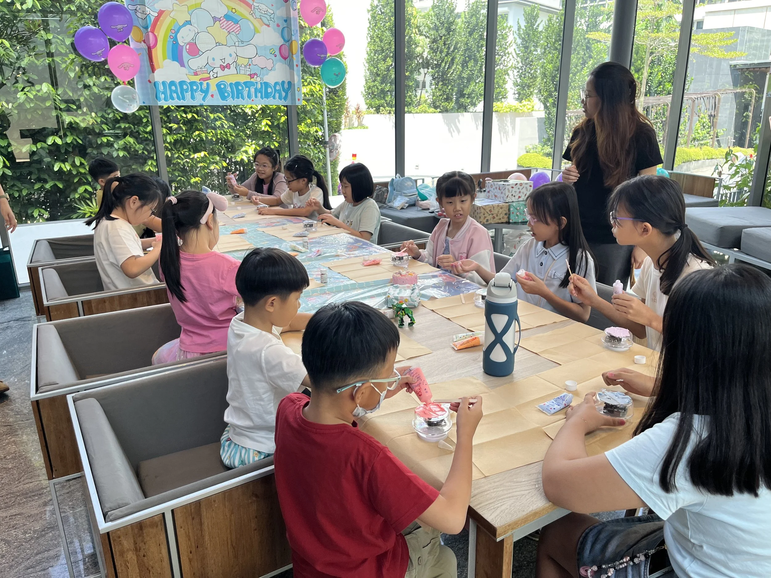 Children creating a 3D pen keychain in a creative STEM workshop