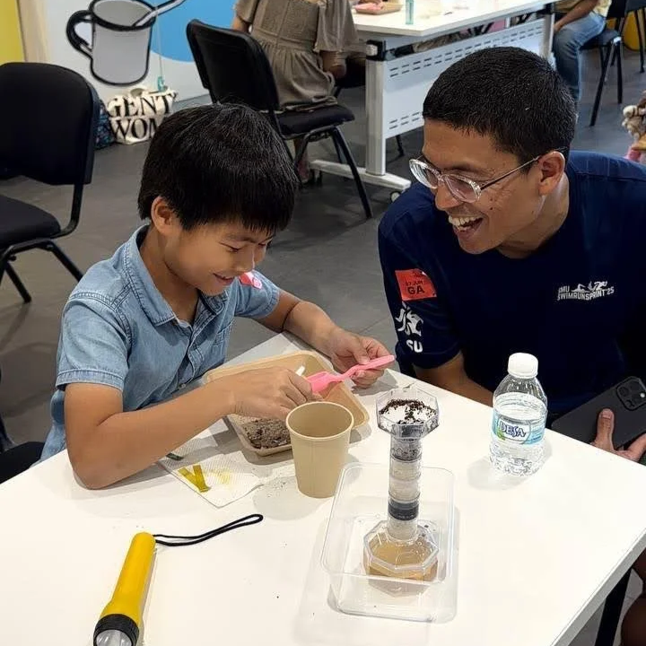 Father_son_doing_water_filtration_understanding_STEM
