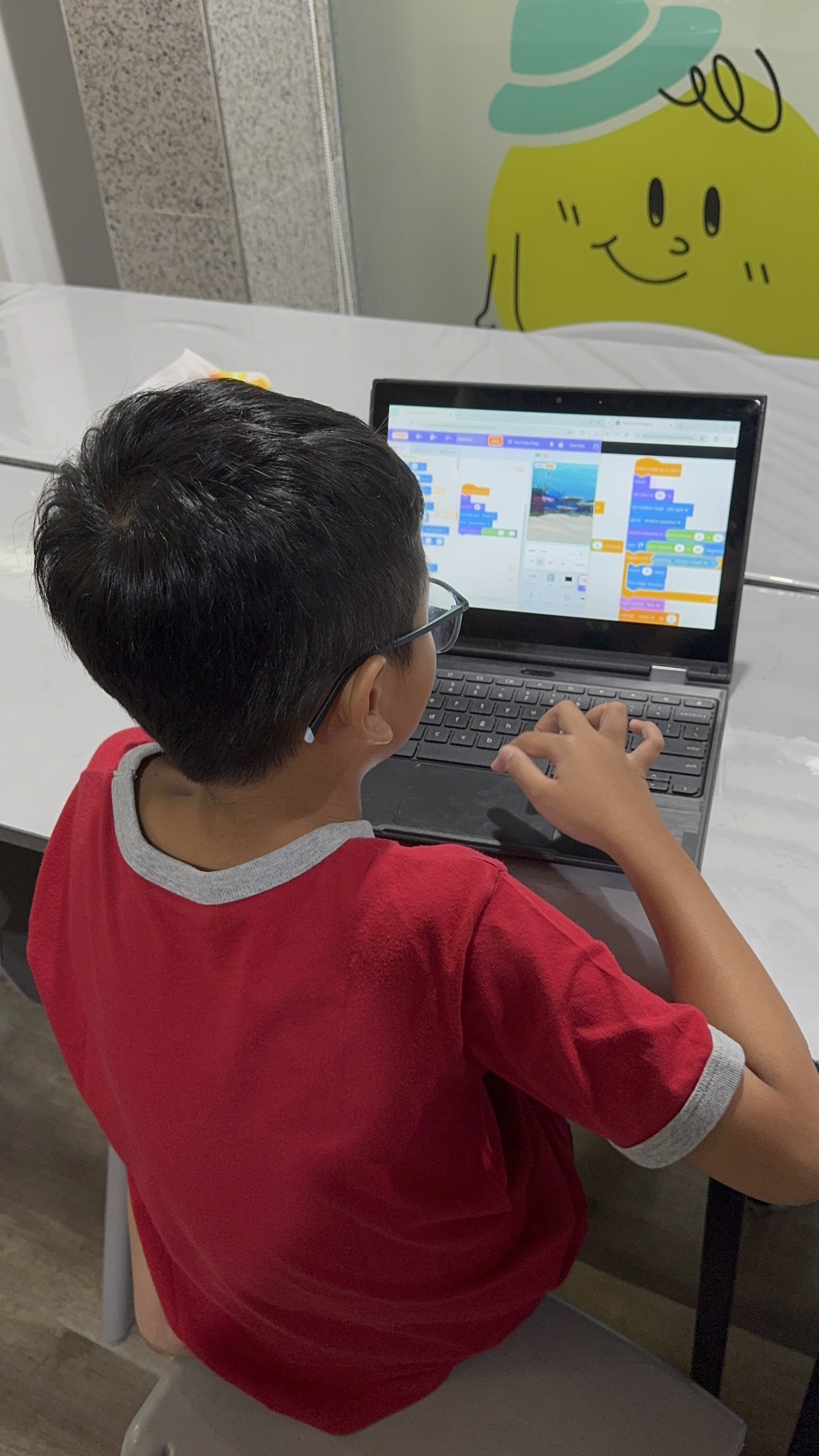 Children building engineering prototypes during a hands-on STEM birthday party activity