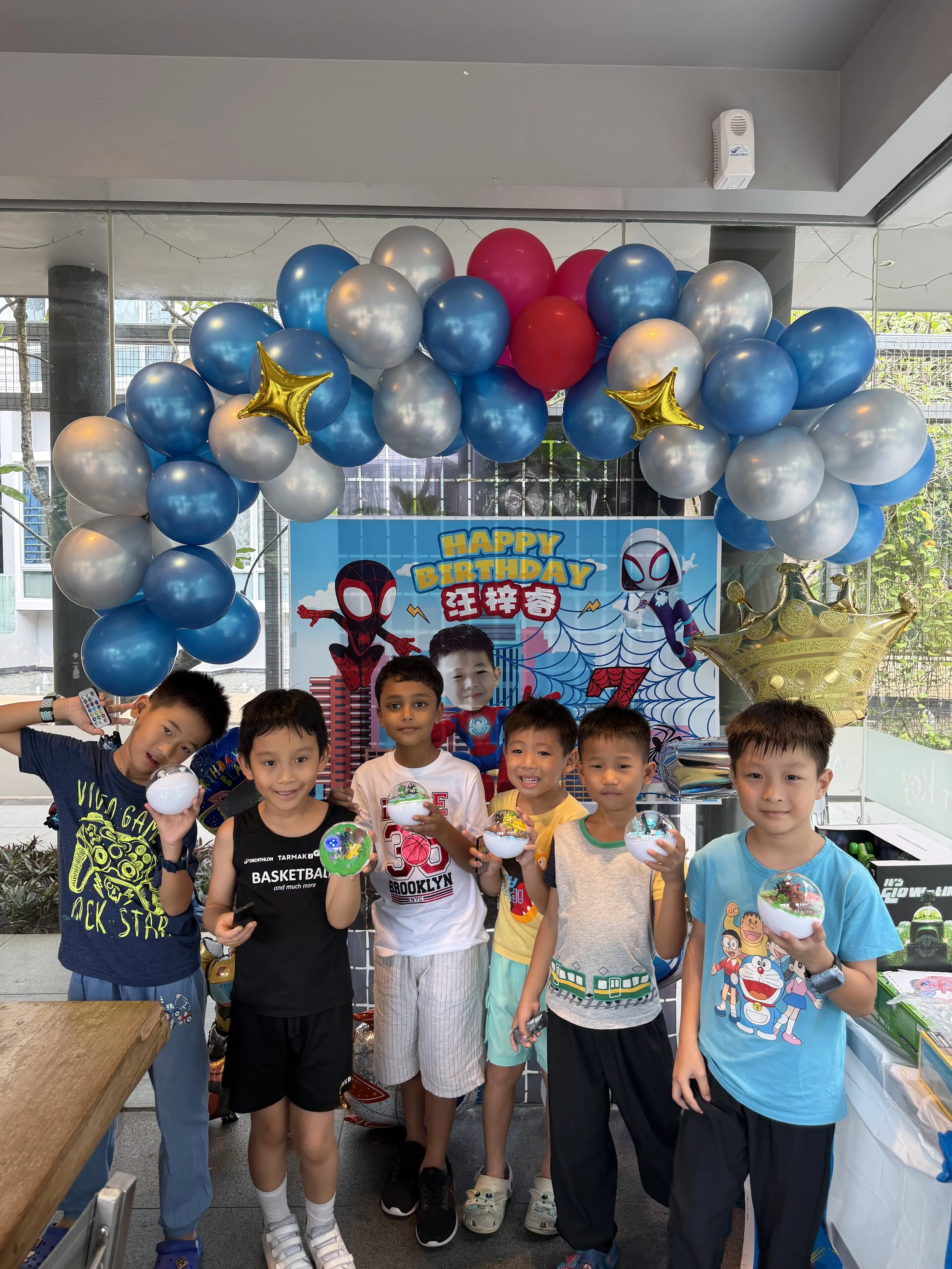 Children building creative engineering projects during a STEM-themed birthday celebration