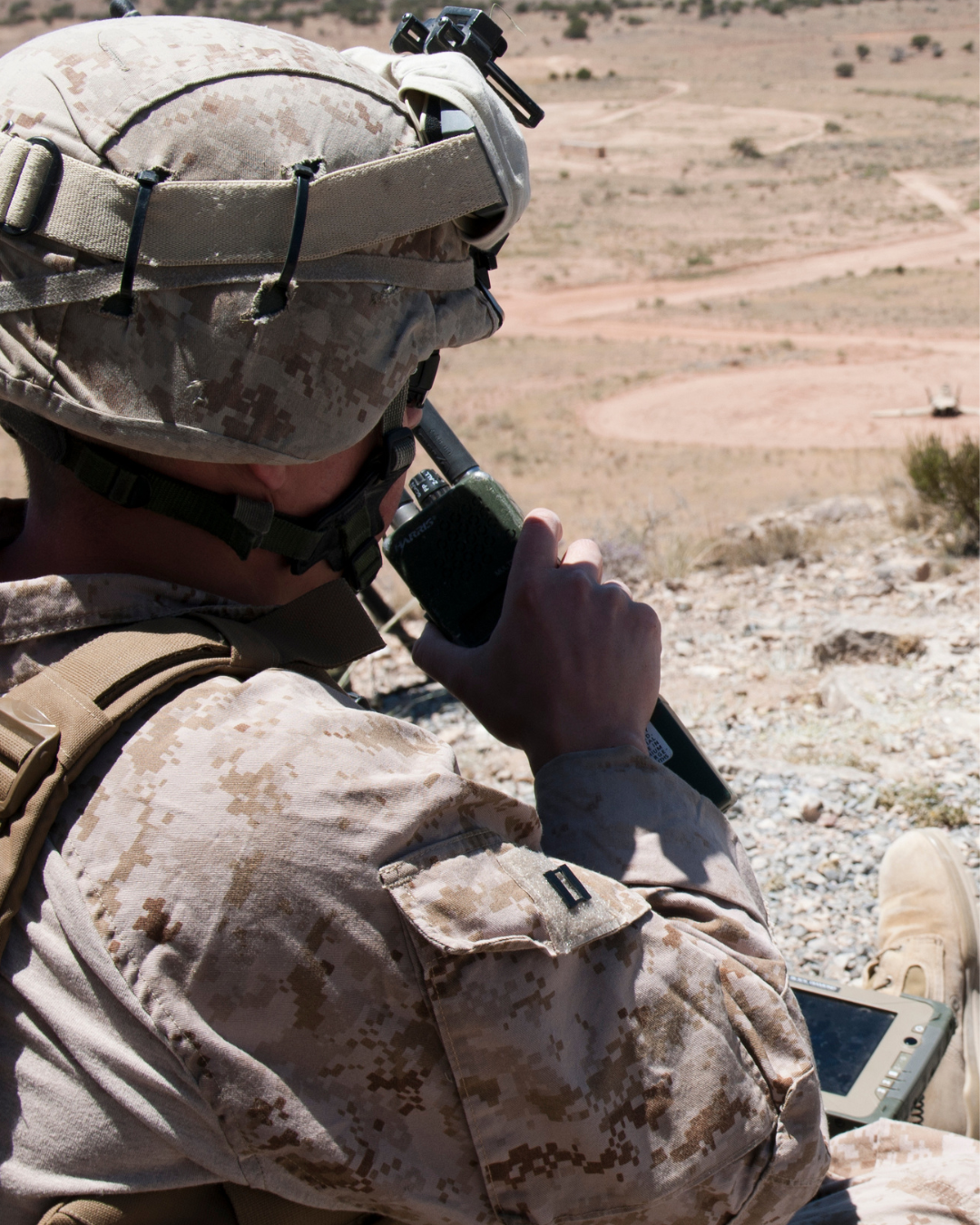 A Marine talking on the radio