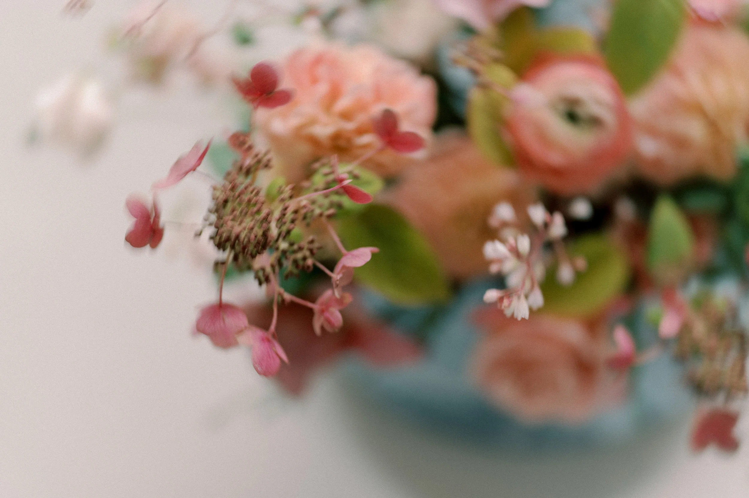 Fall florals for Twig & Bloom Calgary designed with pink roses, peach dahlias, pink hydrangea, and fall foliage.
