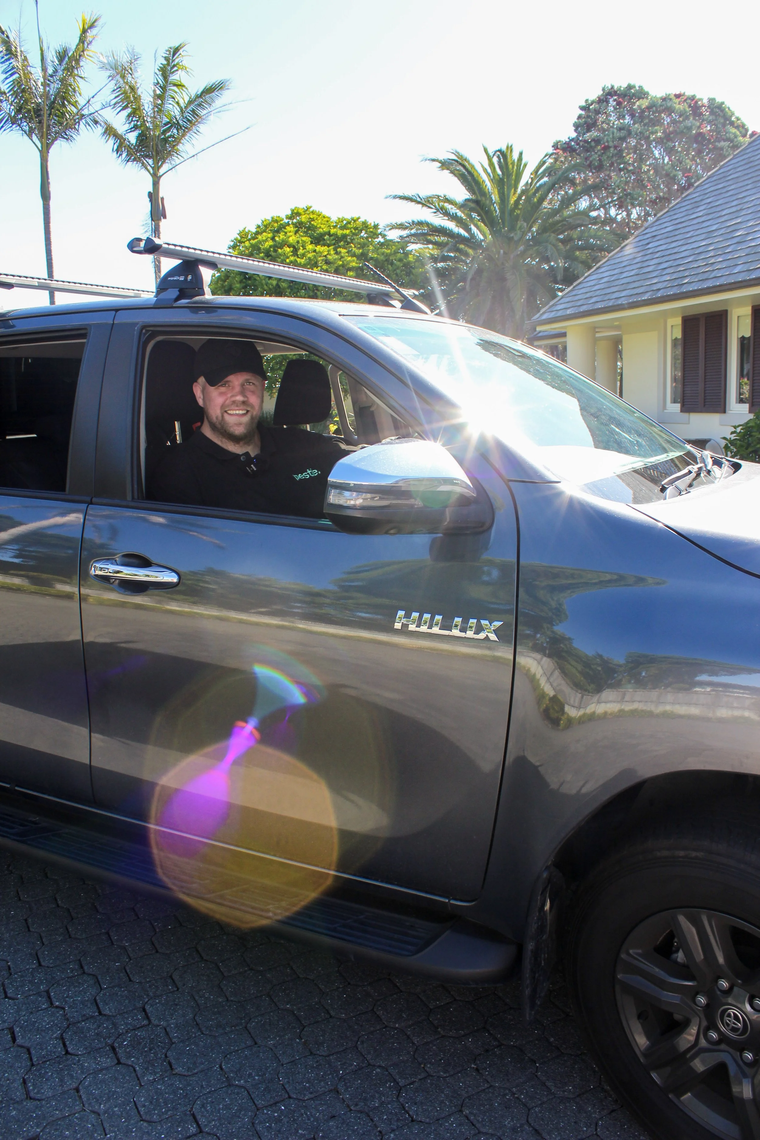 Pestie pest control technician Carlos in branded ute in Auckland.