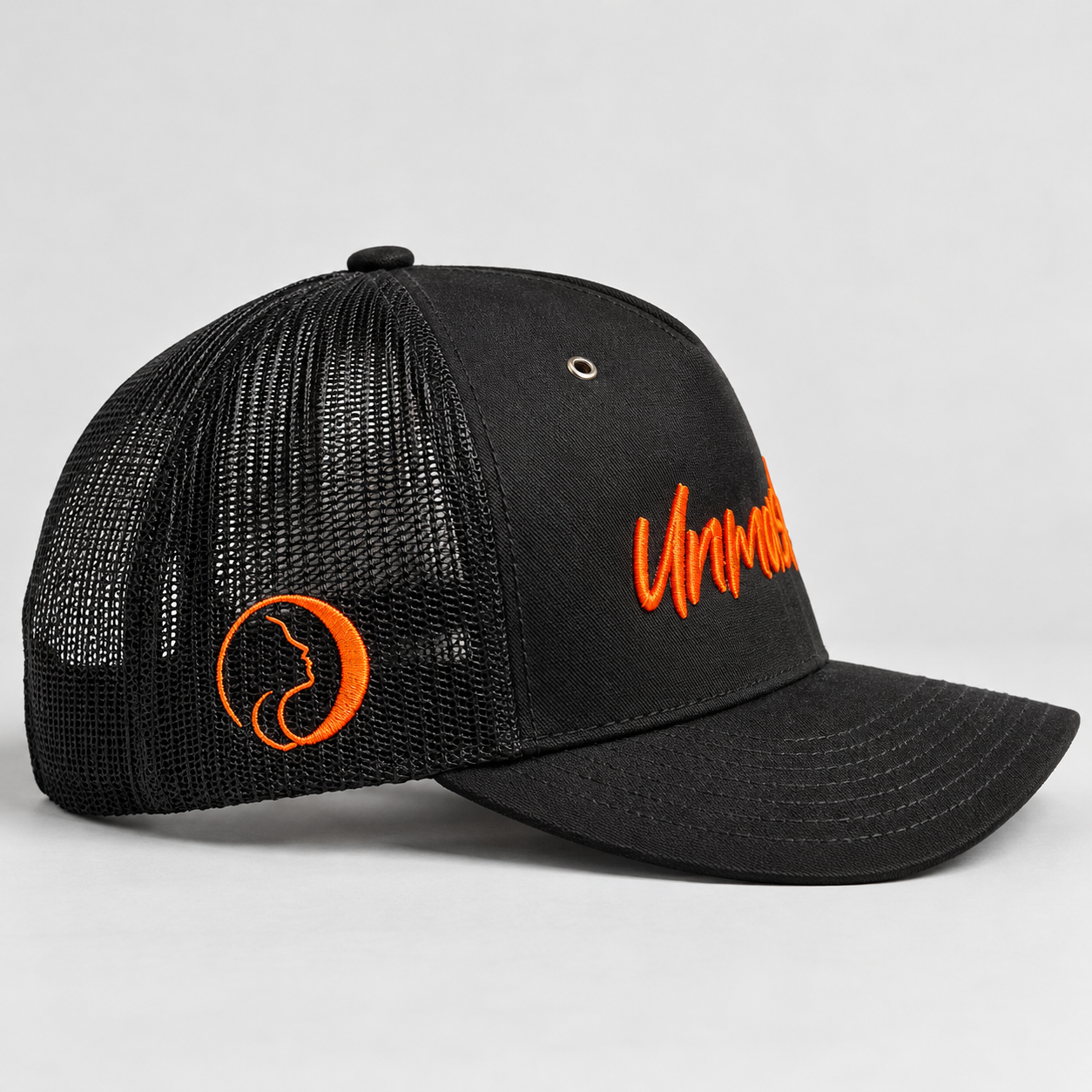 Unmask Black and Orange Side Hat.png